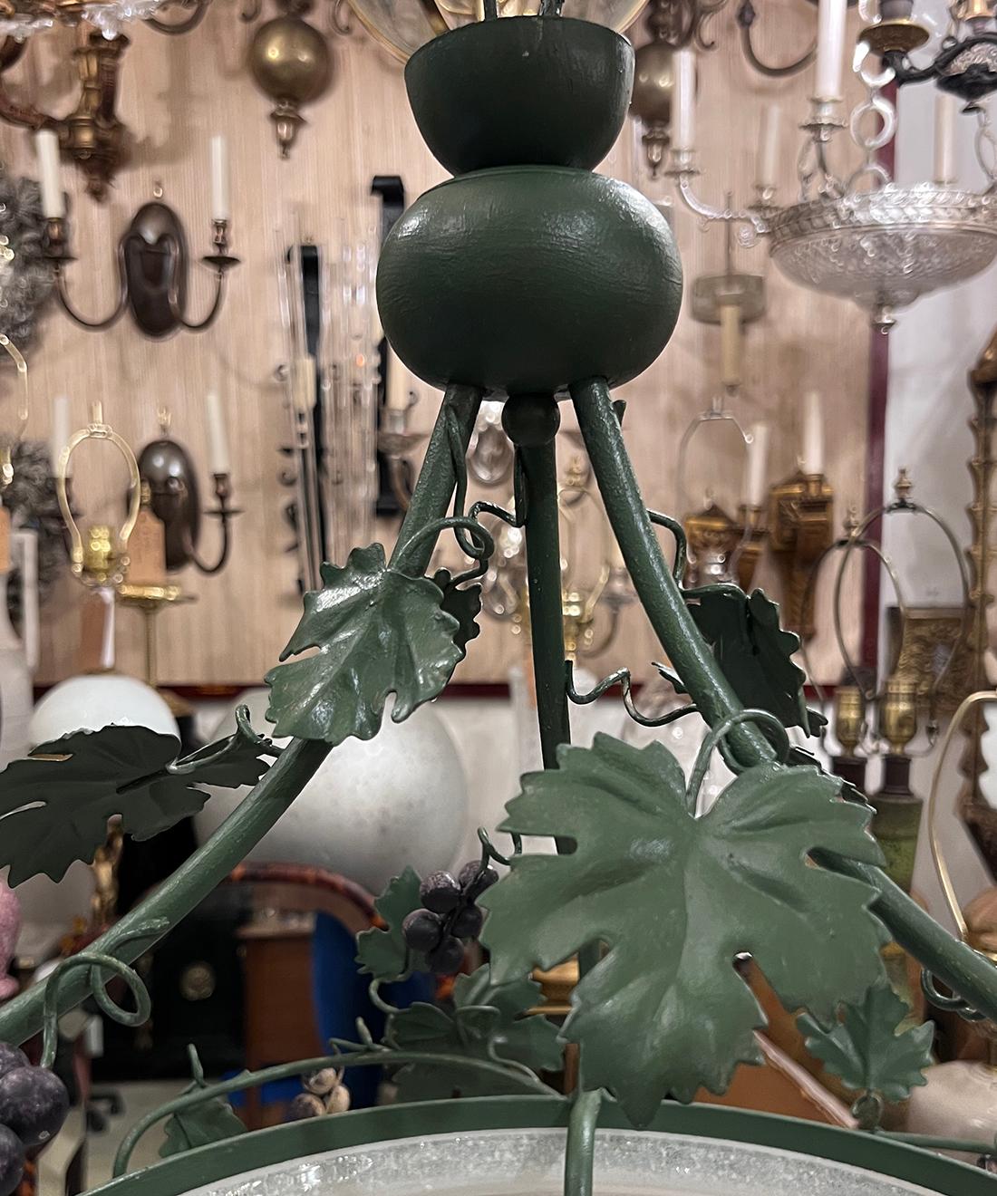 A circa 1950's Italian tole light fixture with grapes and foliage motif. 3 Edison lights.

Measurements:
Min drop: 24