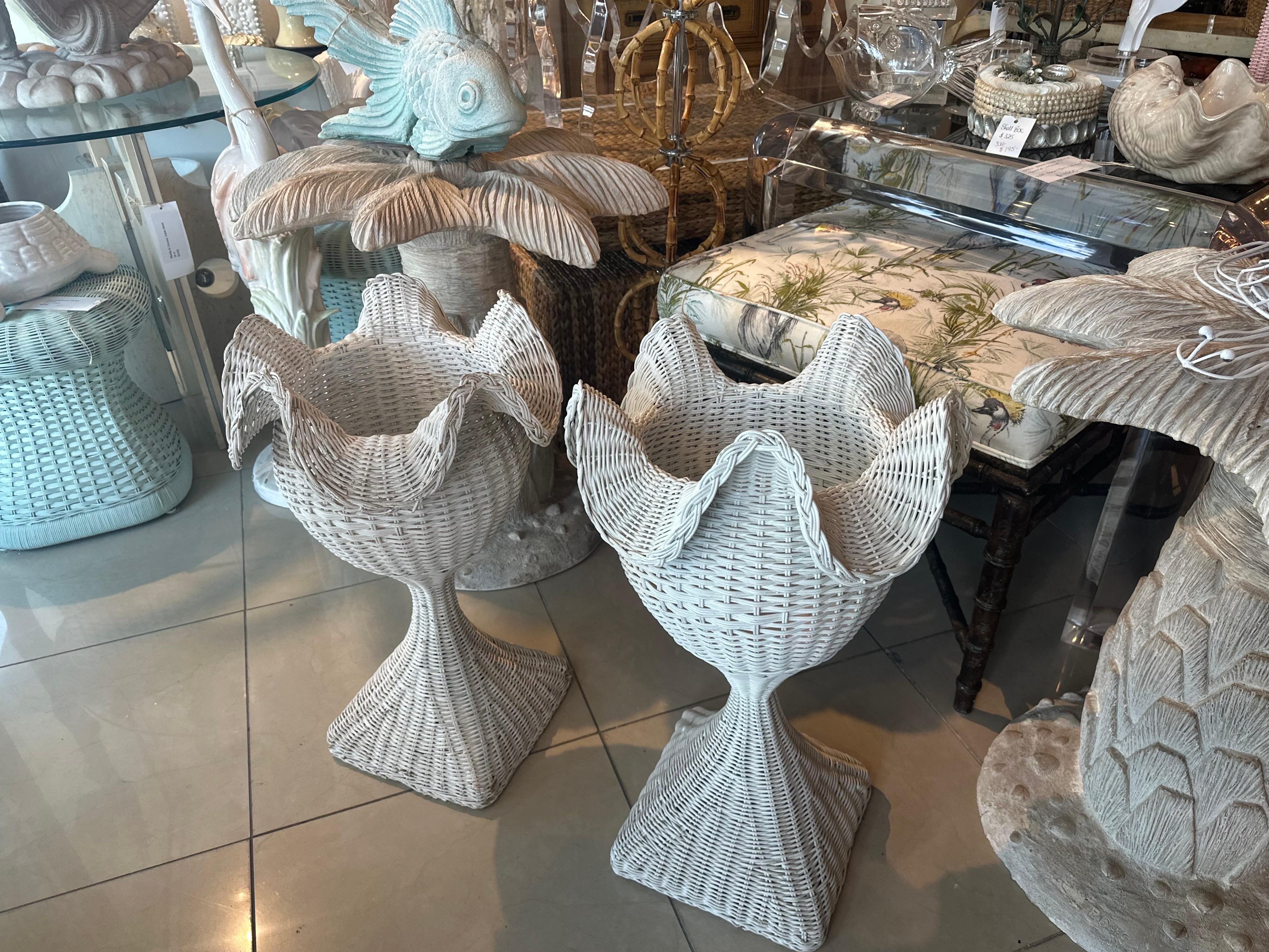 Lovely pair of vintage 1940s French chippy white wicker, scalloped, ruffled edge planters. Original vintage white paint finish is chippy in spots and worn in others. May be slight variations in shape or size due to the handmade nature of wicker.