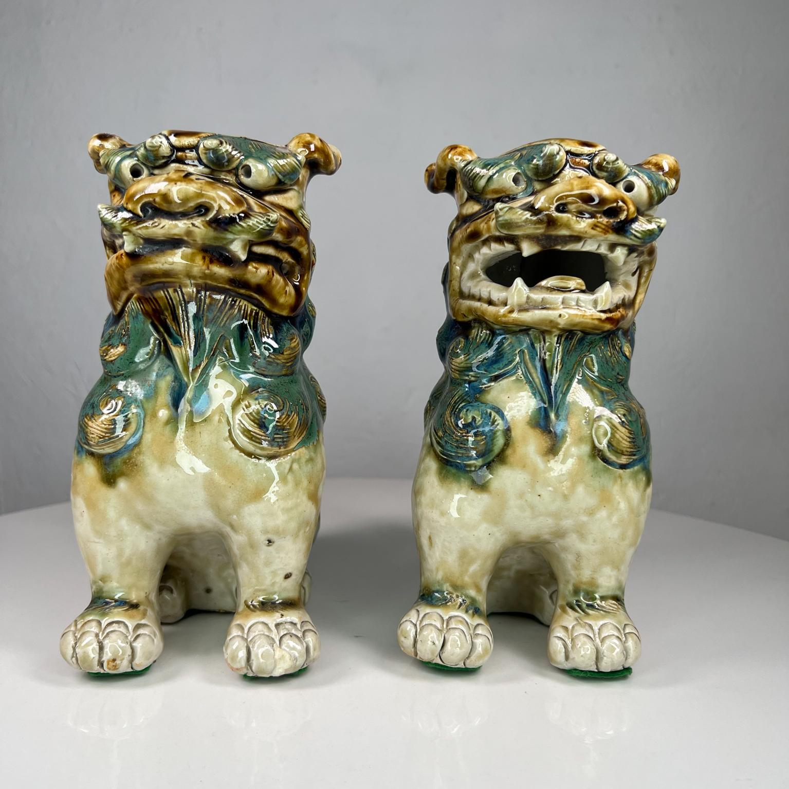 Pair of Antique Chinese figurines foo dog sculpture green glaze ceramic.
8 tall x 3.75 wide x 6.5 deep.
Preowned original vintage unrestored condition.
Refer to images please.