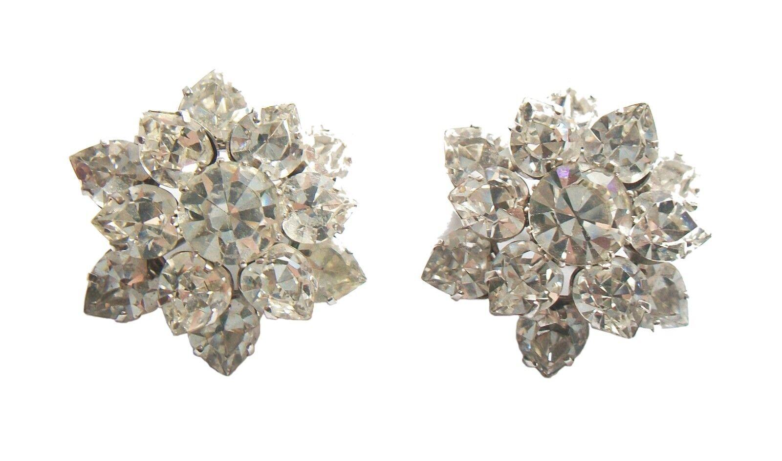 Vintage pair of Austrian crystal rhinestone brooches - fine old world European quality - central round cut crystals surrounded by two level pear shaped stones - original pin with safety catch - 'MADE IN AUSTRIA' stamp on the back - unsigned - mid