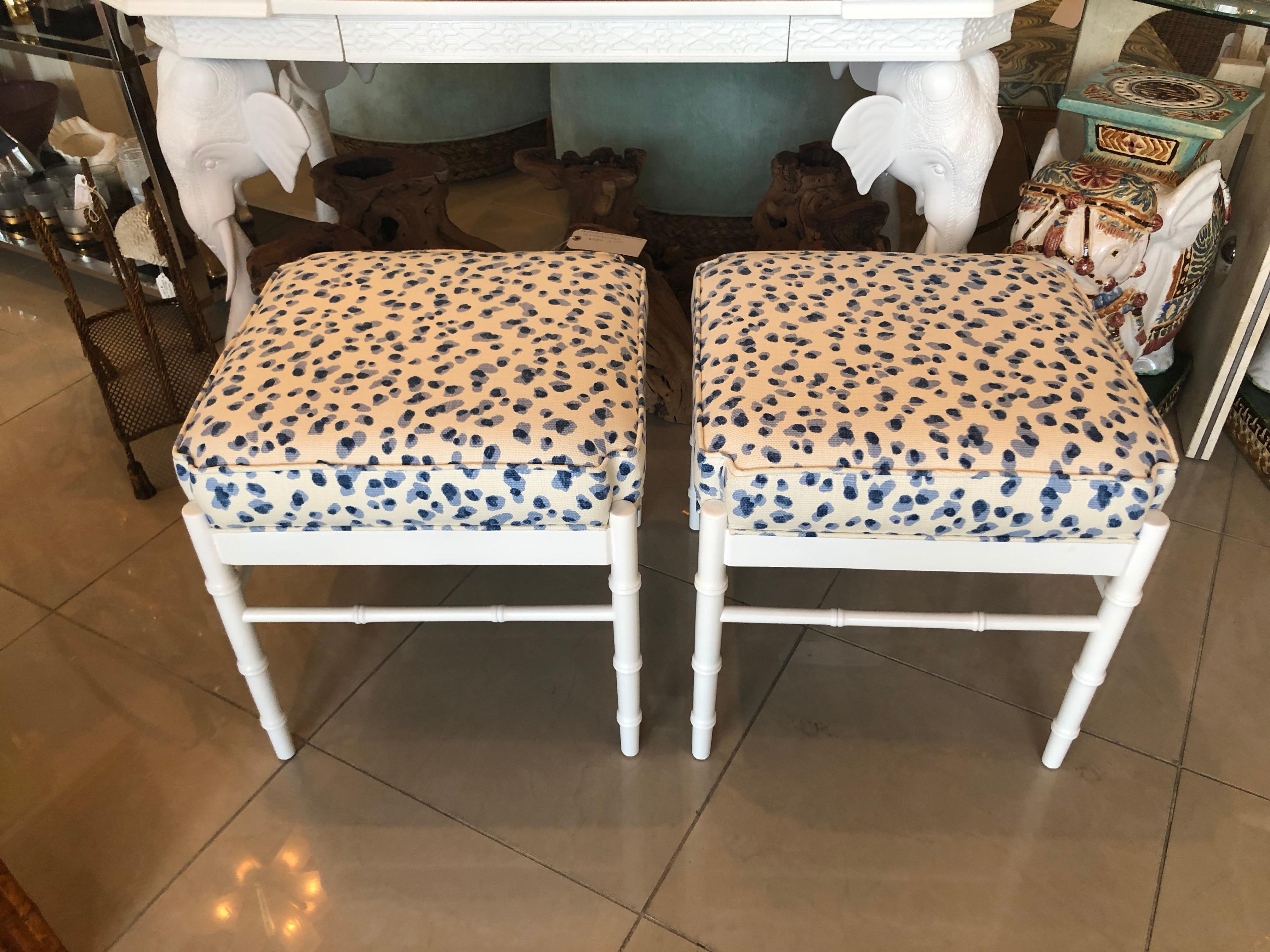 Lovely faux bamboo vintage pair of ottomans, benches, stools. Newly, professionally lacquered in a white gloss finish. Newly upholstered with all new foam.