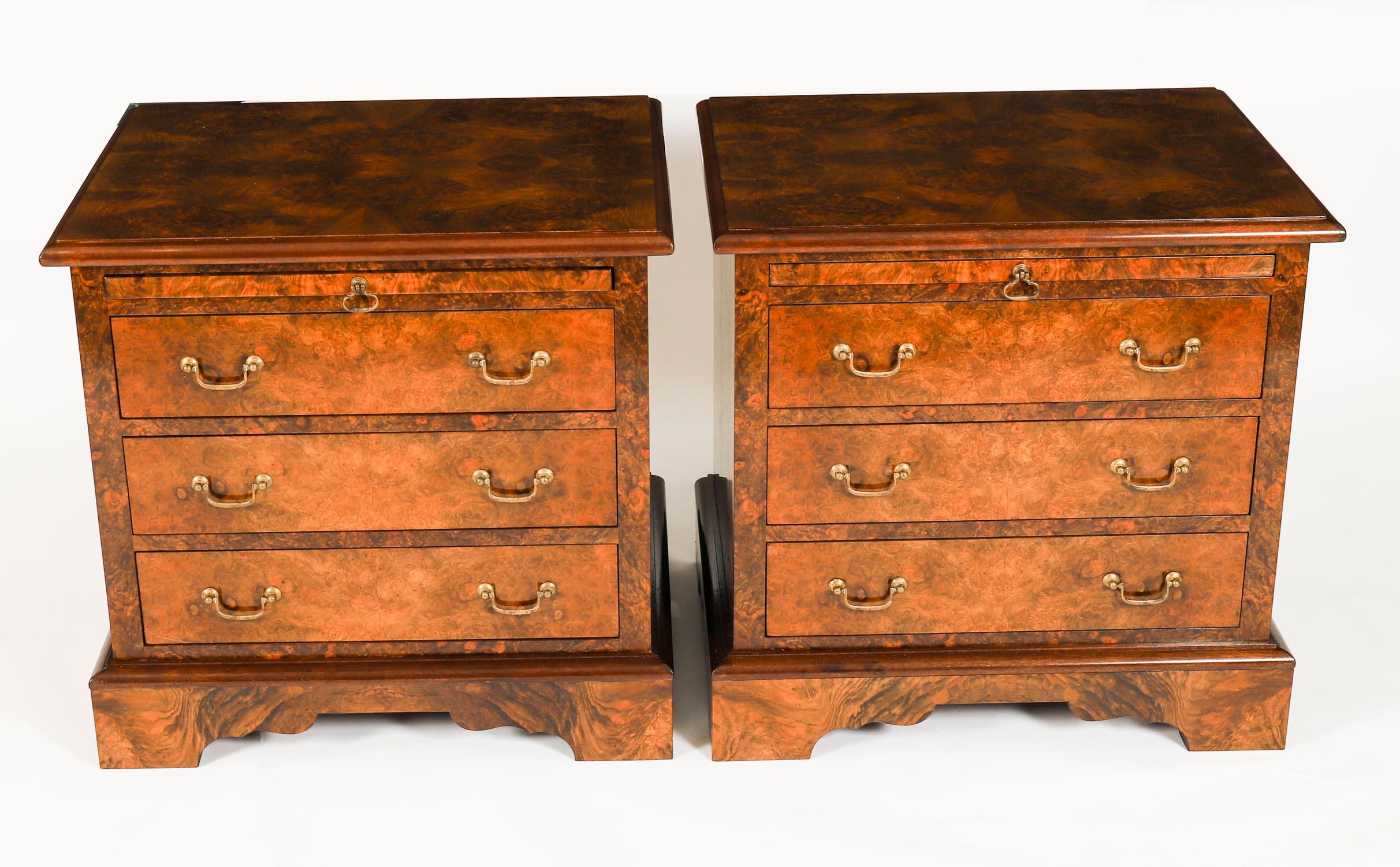 This is a beautiful Vintage pair of Georgian Revival burr walnut bedside chests with slides, dating from the late 20th Century.

The chests are masterfully crafted from gorgeous burr walnut, they each have three drawers, for convenient storage, and