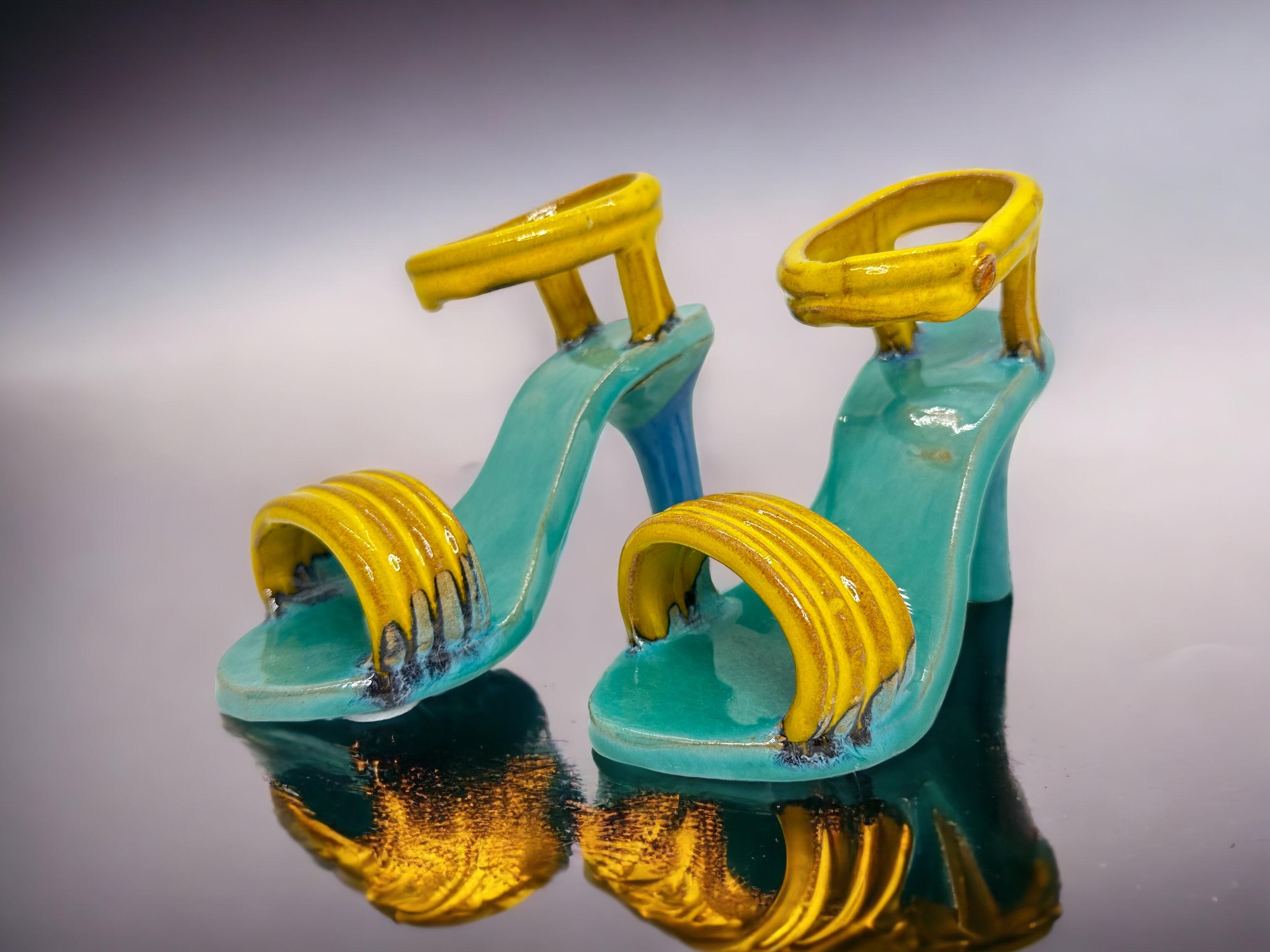 This offer is for a pair of ceramic high heels, an exceptional piece made in Austria during the Bosse era in the 1960s. They are glazed in typical midcentury colors of yellow and turquoise. A beautiful display piece to show the style of the period.