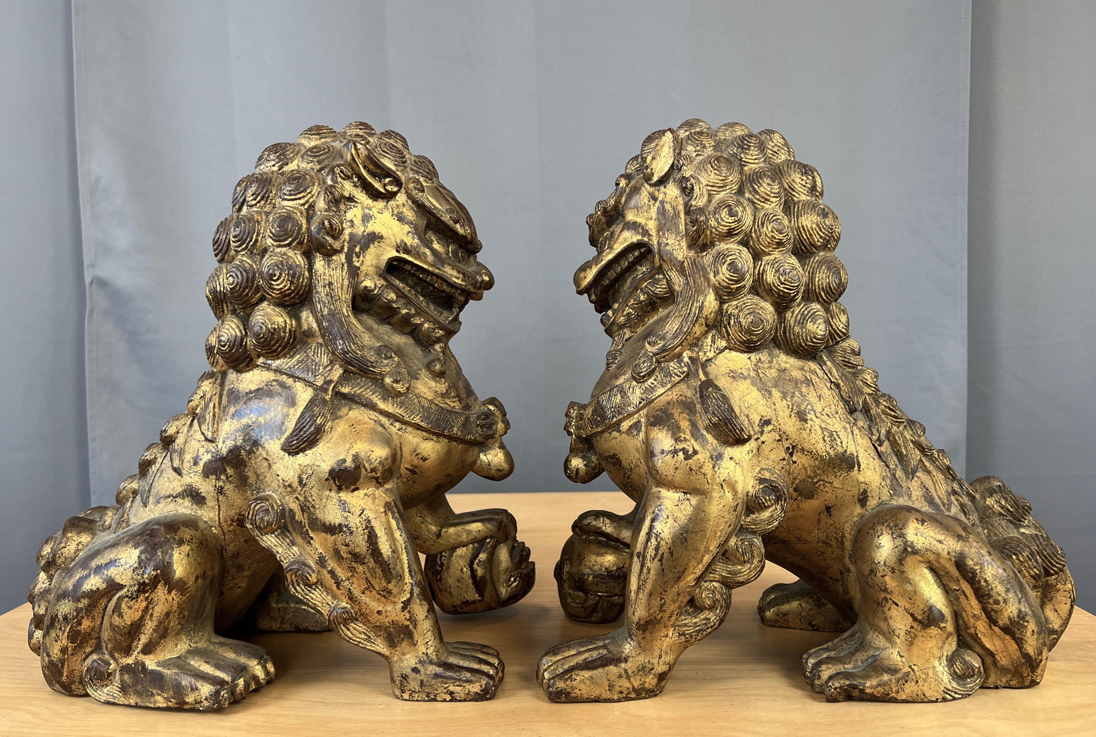 Chinese Export Vintage Pair Chinese Gilt Carved Wood Foo Dog / Guardian Lions Figurines For Sale