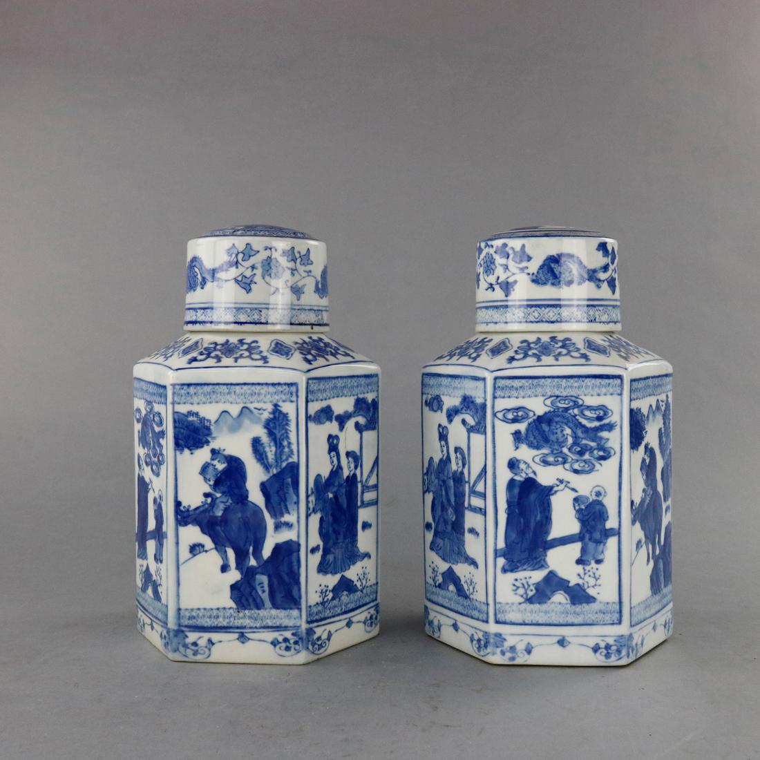 A pair of vintage Chinese blue and white Canton School ginger jars offer paneled porcelain construction with genre scenes having figures in countryside setting, label on bases as photographed, 20th century

Measures: 10.5