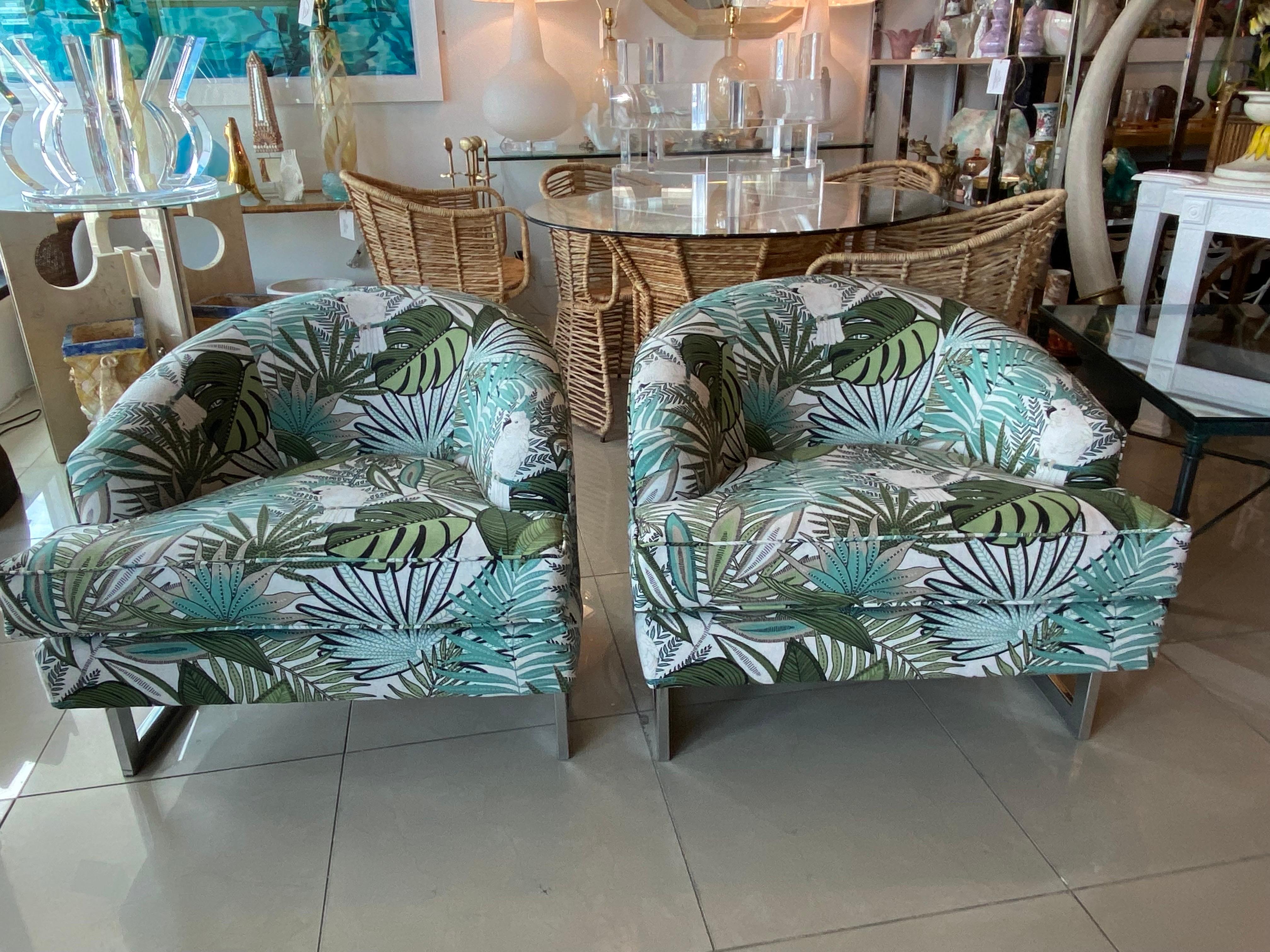 Vintage pair of amazing chrome cantilever arm chairs, tub, barrel in the style of Milo Baughman. These have been newly upholstered and all new foam inside as well. Lovely tropical cockatoo makes this tropical upholstery even more special!