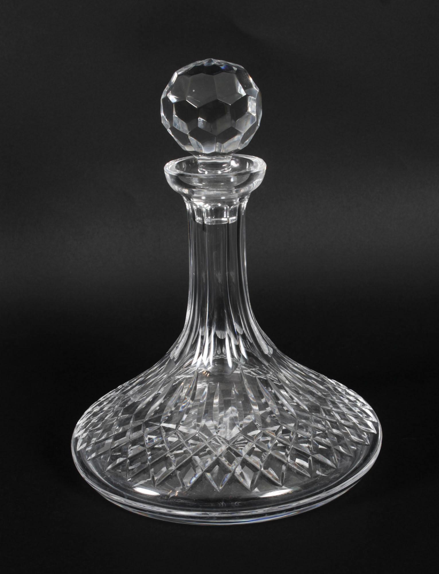 This is a beautiful pair of cut glass ship's decanters with faceted ball stoppers, dating from the mid 20th Century.

Add a touch of elegance to your next dining experience.

Condition:
In excellent condition, please see photos for