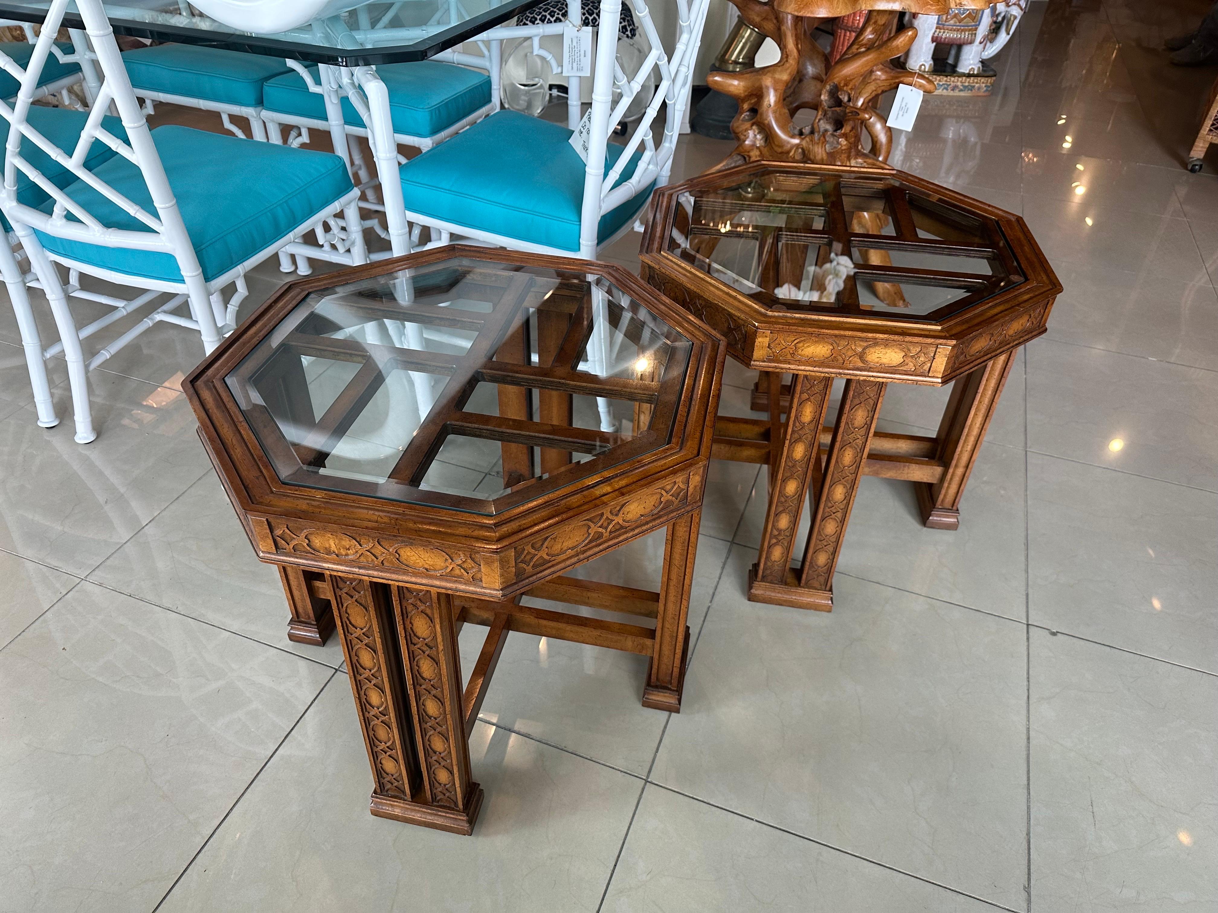 Vintage pair of wood, Chinese Chippendale fretwork, octagonal side end tables with glass tops. Original wood finish. Original vintage glass may have scratches but no breaks. Dimensions: 24 W x 24 D x 21.5 H.