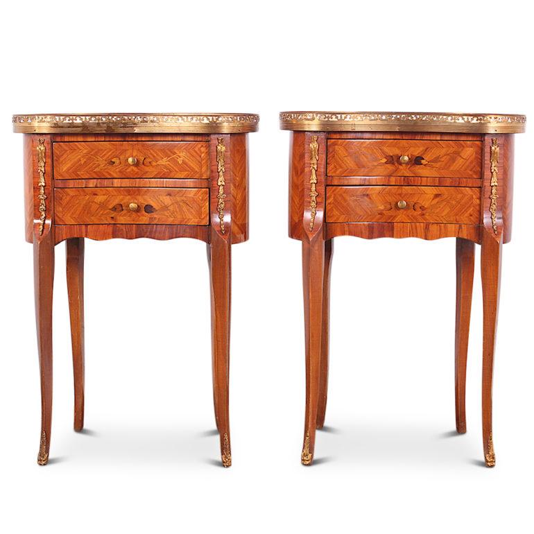 A very rare pair of inlaid Louis XV style kidney shaped tables or nightstands. Highly-inlaid with floral marquetry on all sides, the top with pierced brass gallery. Original gilt drawer pulls and with ormolu mounts to cases and feet. 


 