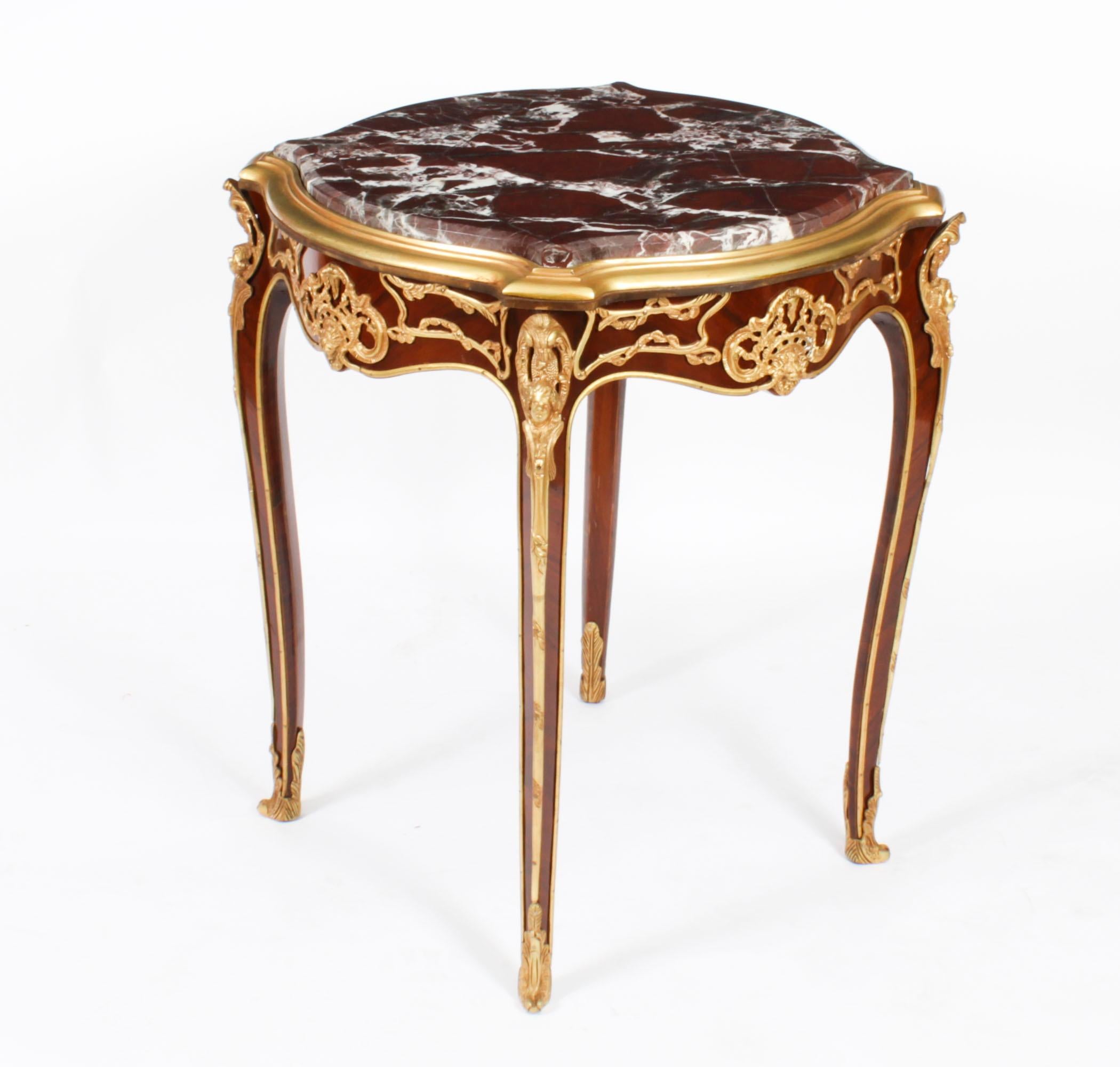 This is a beautiful pair of vintage French Louis Revival ormolu mounted side tables, mid 20th century in date.

The shaped 