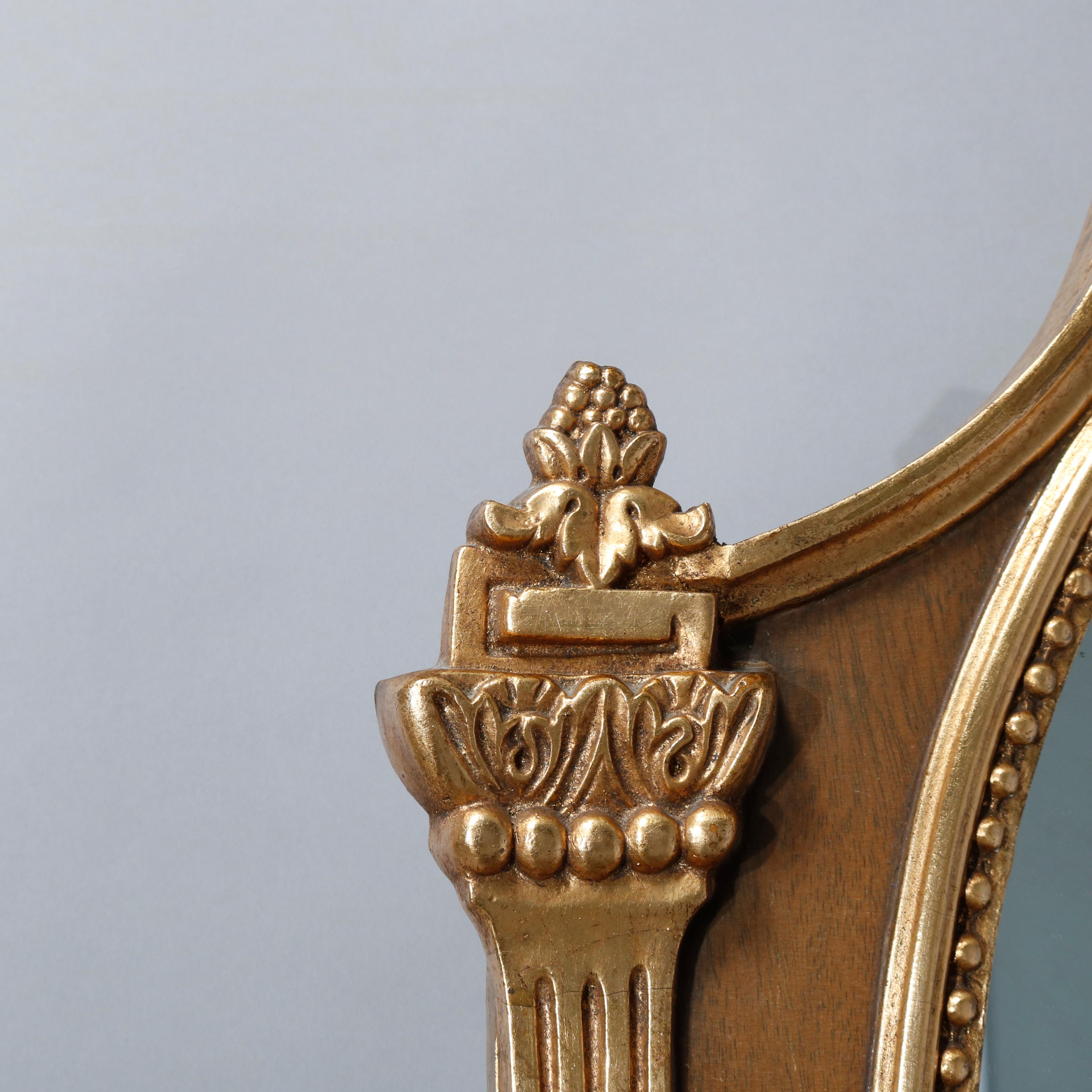 Louis XV Vintage Pair of French Shield Form Parcel-Gilt Mahogany Wall Mirrors, circa 1940