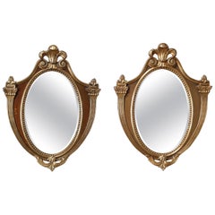 Vintage Pair of French Shield Form Parcel-Gilt Mahogany Wall Mirrors, circa 1940