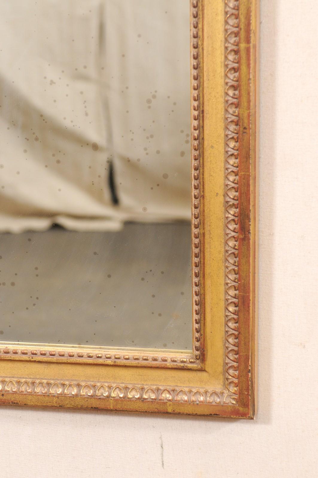 20ième siècle Paire de miroirs d'appoint dorés avec bordure en ébène, 2 pieds de large x 2,5 pieds de haut en vente