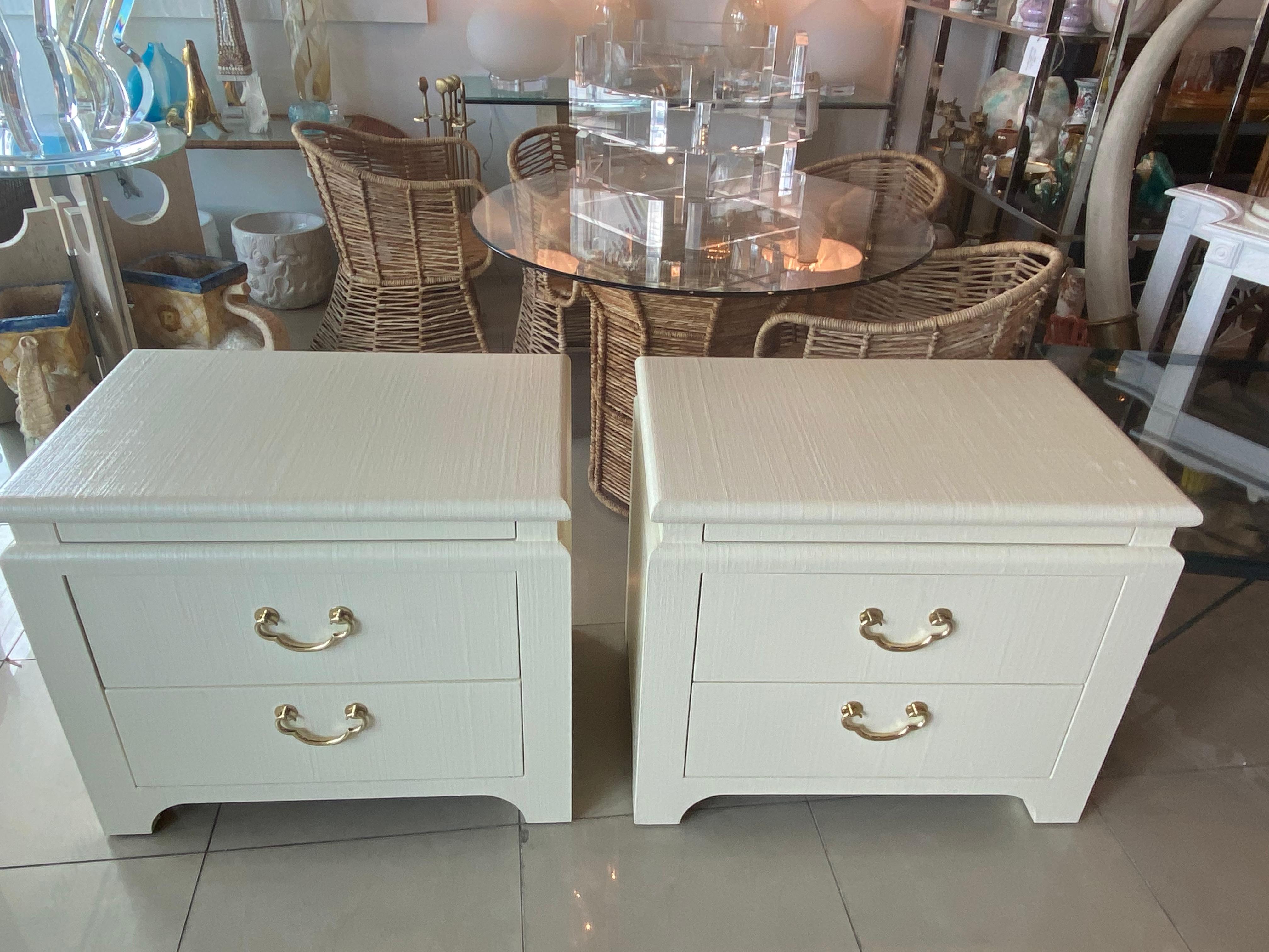 Lovely pair of vintage raffia Harrison Van Horn nightstands chests. These have been newly lacquered in a creamy linen color. Brass hardware has been professionally polished. These are finished on all sides including backs so they can float in a room