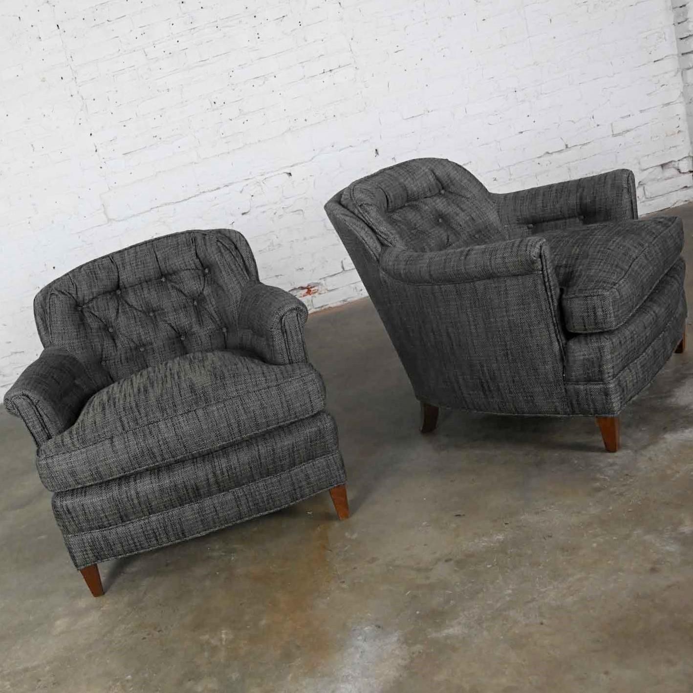 Handsome pair of vintage Henredon club chairs or lounge chairs upholstered in Escapade fabric by Fabricut in their Carbon colorway, which is a charcoal gray tweed, with button back detail. Fabulous condition, keeping in mind that these are vintage