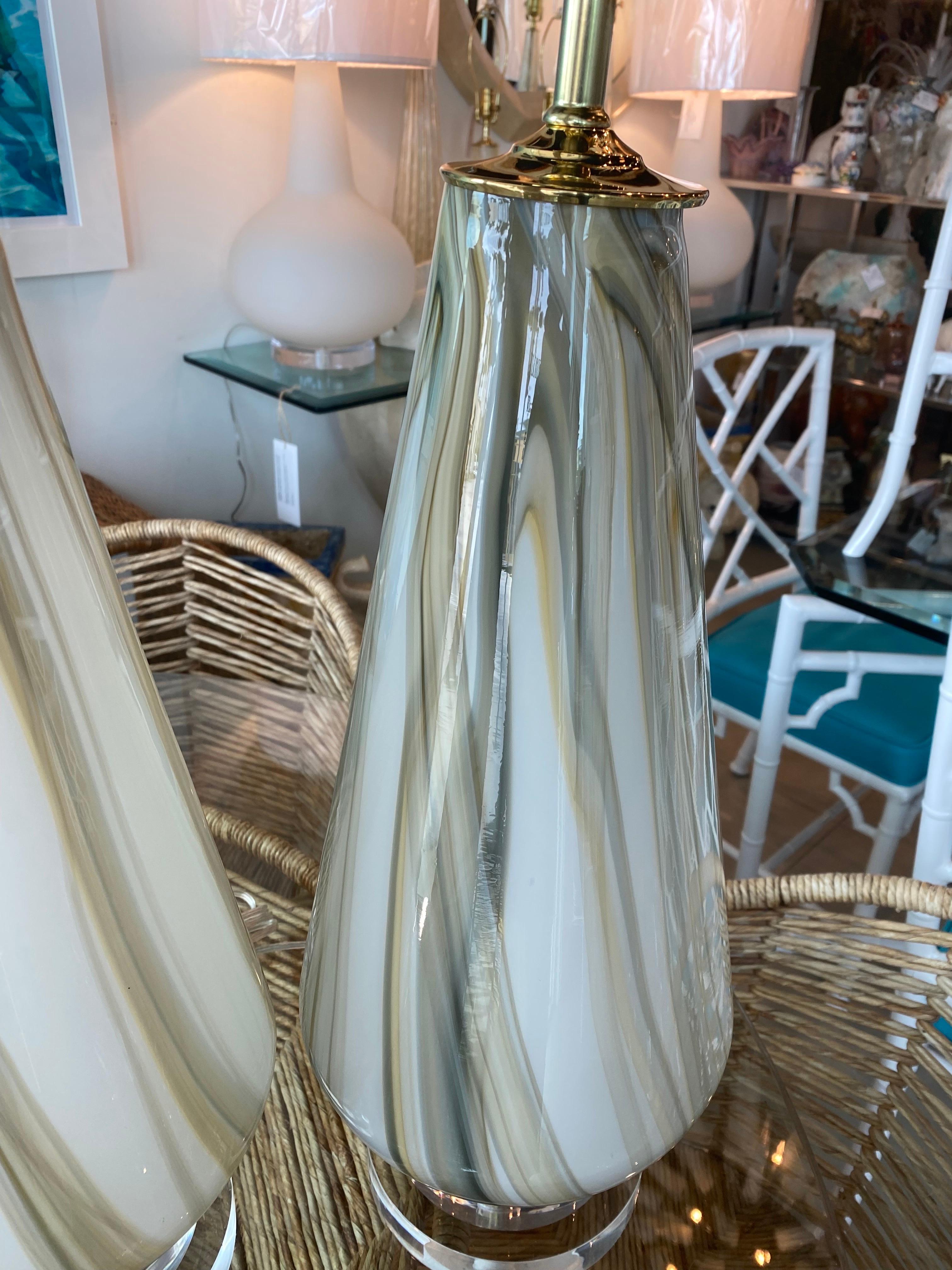 Amazing pair of large vintage Murano glass lamps. Beautiful marble swirl glass design. These have been restored to perfection. Newly wired, 3 way brass sockets, brass vase caps, lucite finials and double lucite custom bases. These are so beautiful!