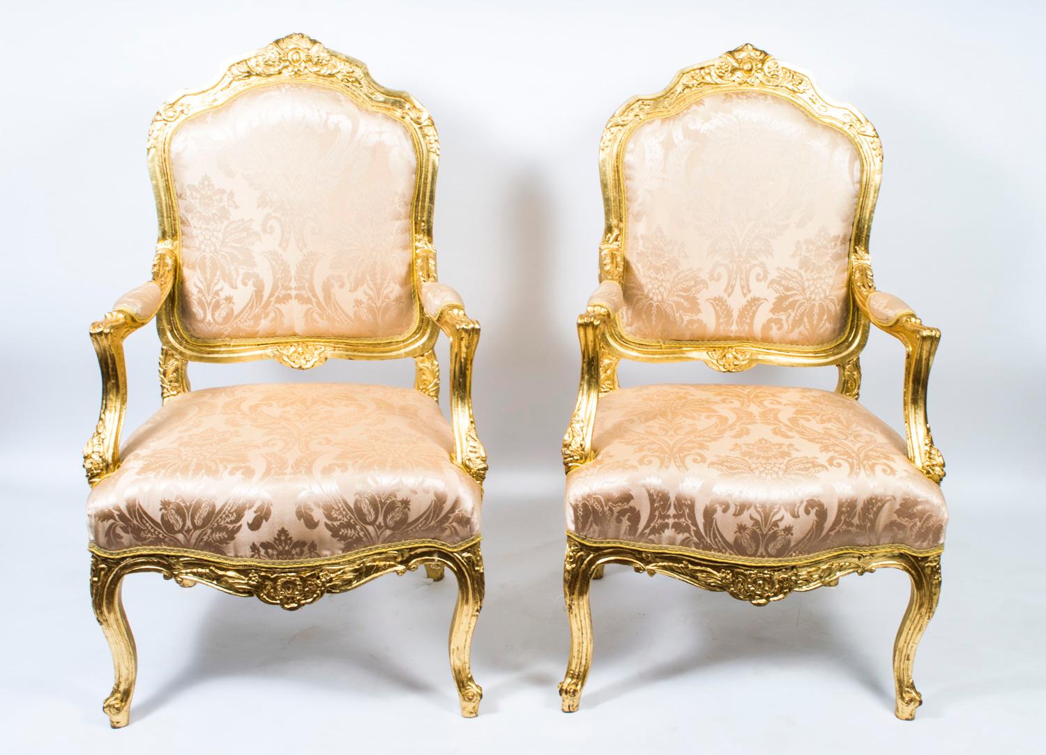 This is a stunning pair of French carved giltwood armchairs in the Louis XV style and dating from the last quarter of the 20th century.  

The chairs feature hand-carved decoration and have been reupholstered in a gorgeous patterned fabric.

Add a