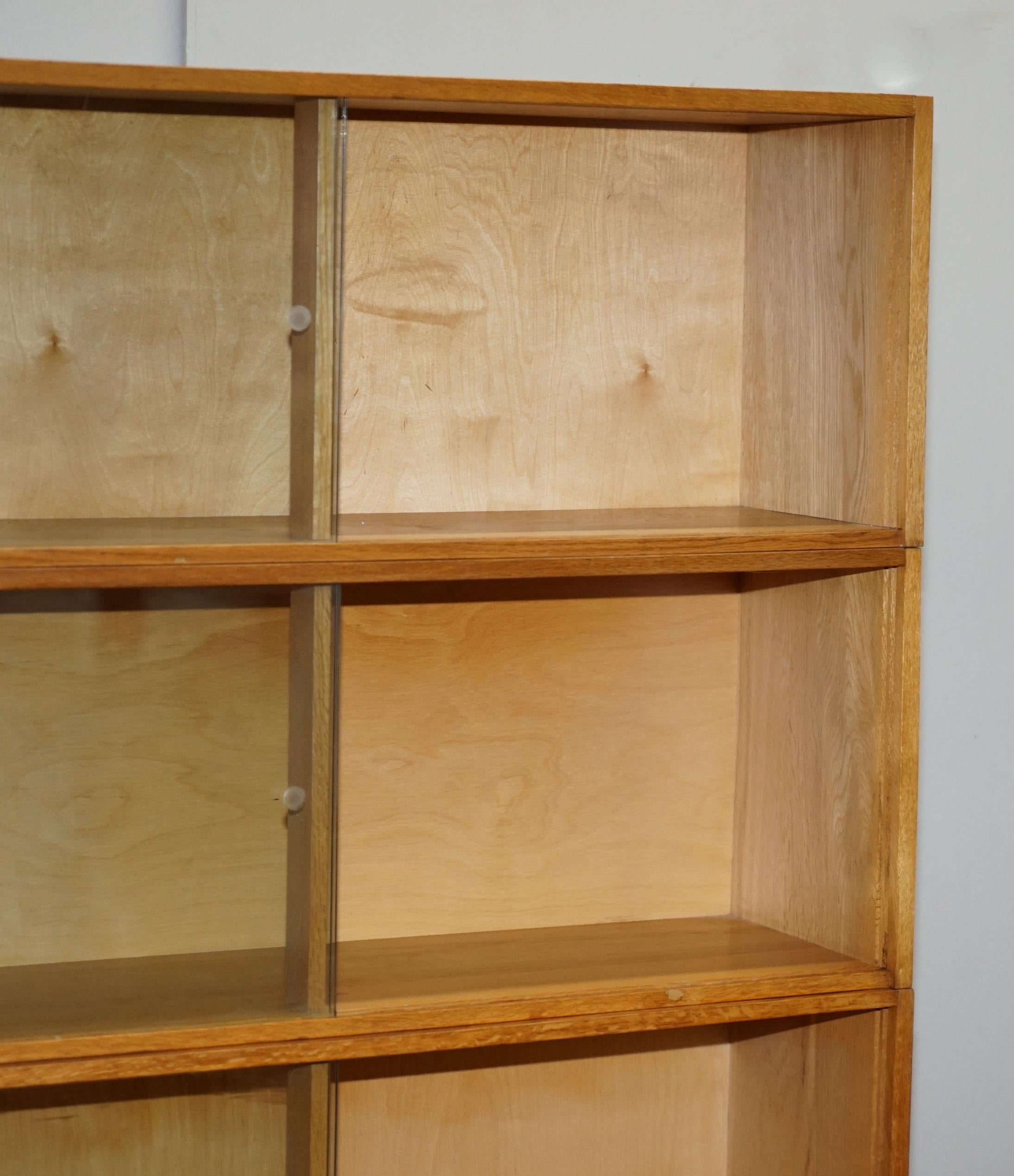 Late 20th Century Vintage Pair of 1972 Oak Stacking Library Legal Bookcases, Glass Sliding Doors For Sale