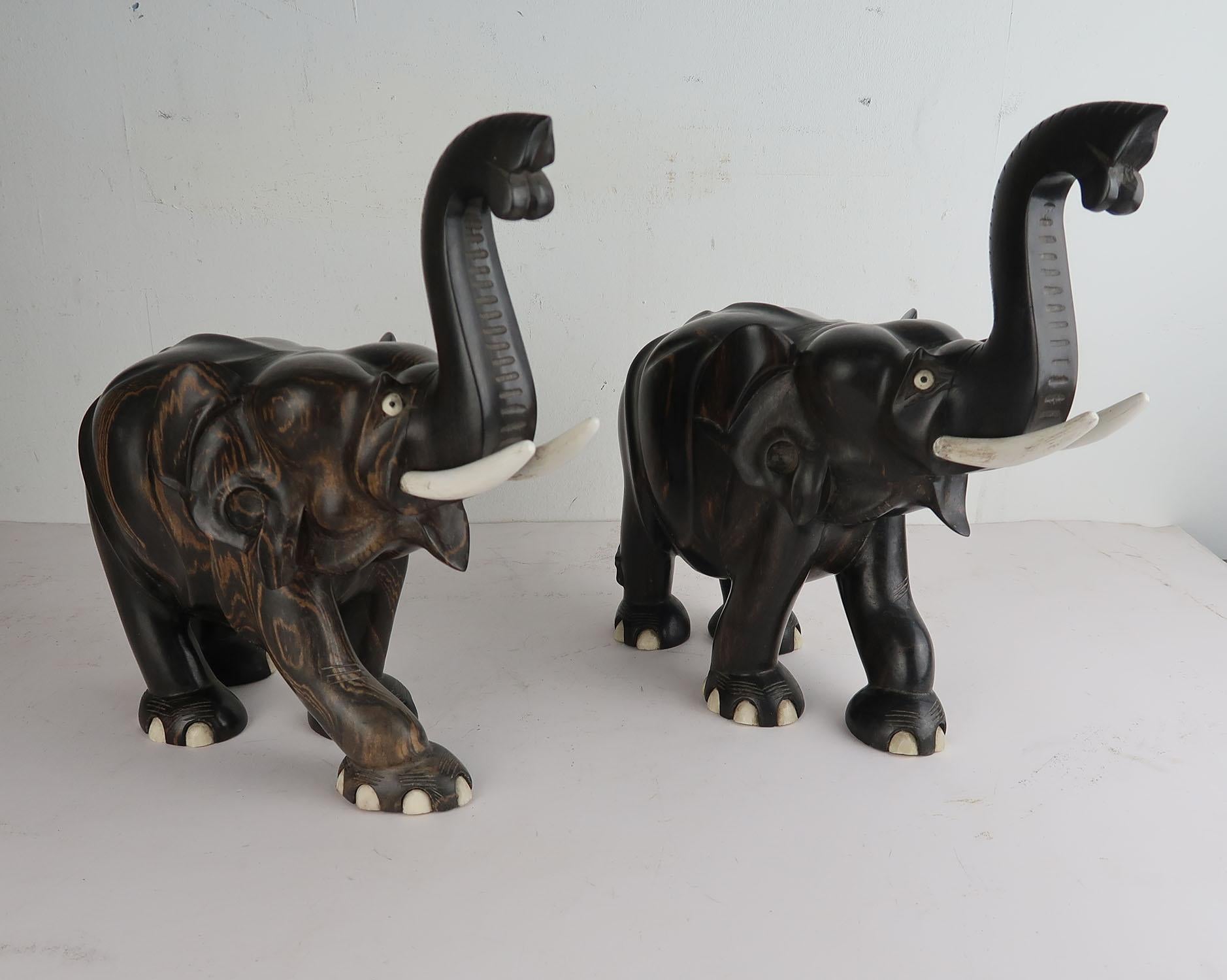 Great pair of elephant figures

Make really good bookends

Carved Tropical hardwood and painted wood tusks.

Probably Indian, 1930s.

The measurement given is for one of them






