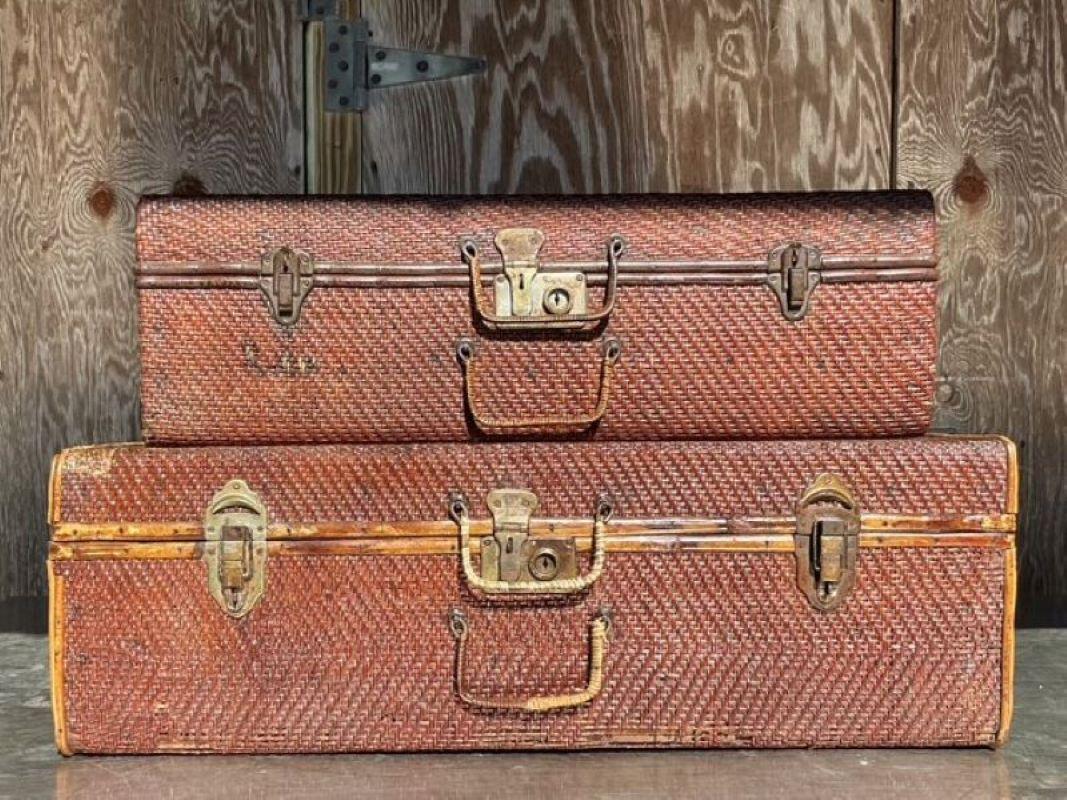 The Vintage Pair of Bamboo and Woven Rattan Travel Trunks are both functional and aesthetically pleasing, combining natural materials with skilled craftsmanship. With their woven rattan panels, bamboo frames, and metal hardware, these trunks evoke a