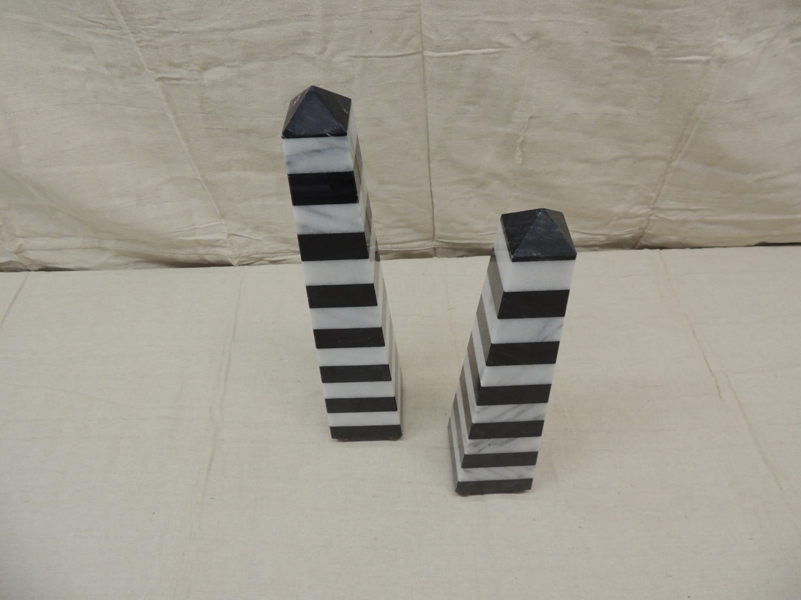 Vintage pair of black and white stripes marble obelisks with antique brass finished round feet (4 on each one)
Handcrafted in Asia
Top of both of the obelisks end on cuppulas.
Sizes:
Left one is 3 x 3 x 15.5 H
Right one is 3 x 3 x 13.5
25