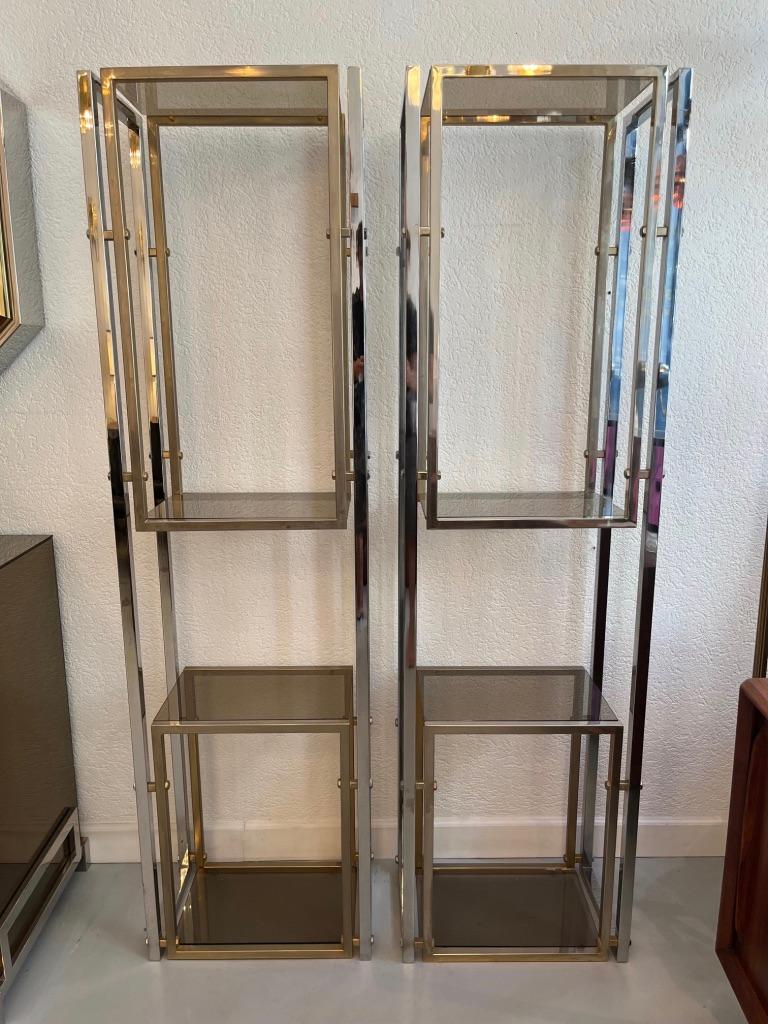 Elegant vintage pair of chrome, brass and glass shelves in the style of Romeo Rega, Italy ca. 1970s
Good vintage condition, minor fading on the brass.
Measures: H 175 x L 48 x D 30 cm each.