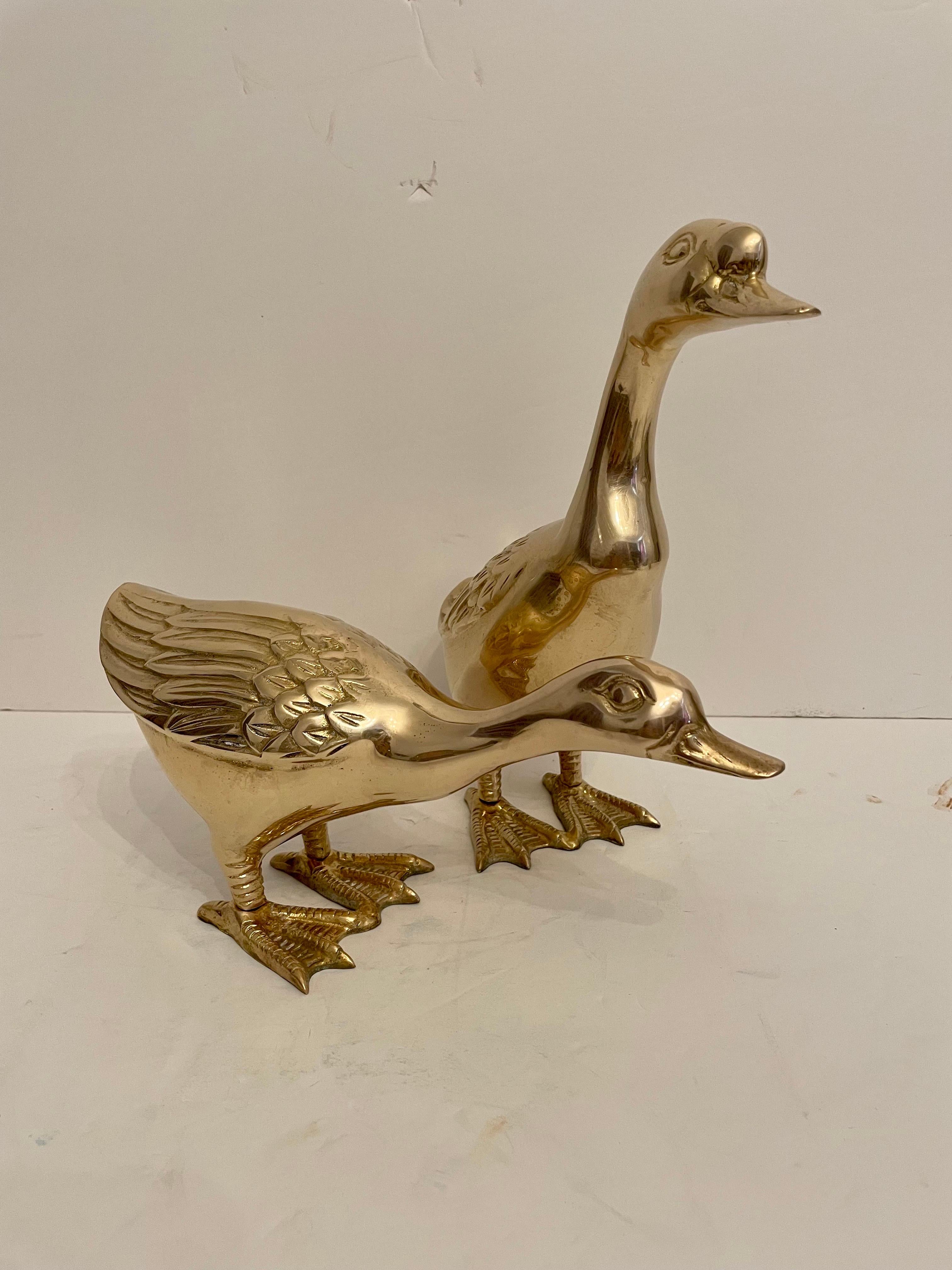Vintage pair of large brass ducks. Nice detailing in the feathers, larger one measures 10