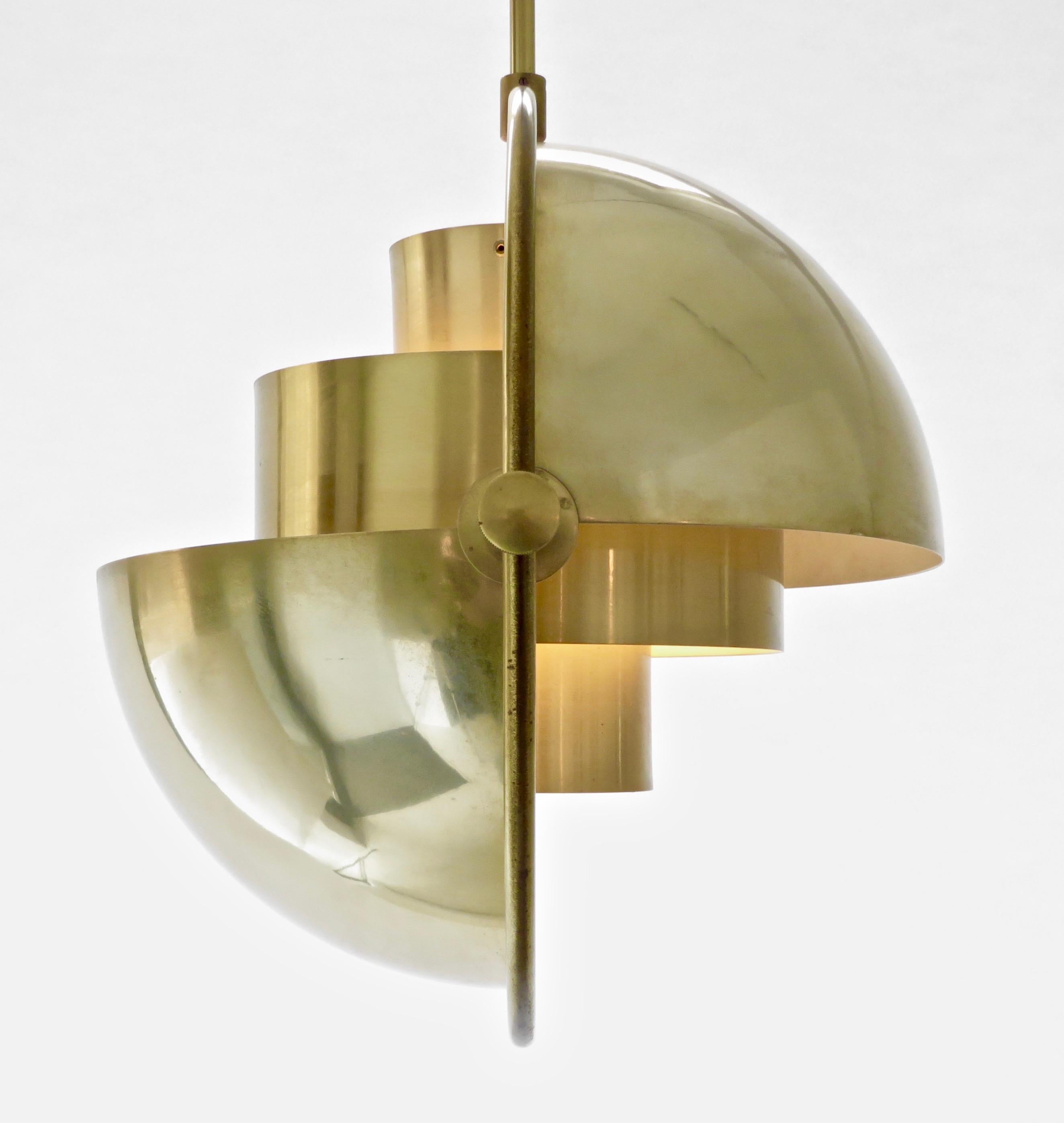 Brass vintage multi-lite pendant by Louis Weisdorf for Lyfa Denmark.
Rewired for USA. Single light source. Bulb up to 120 W.
The pendants have their original label Lyfa and are not reproductions. 
The core of the multi-lite is a two-cylinder form