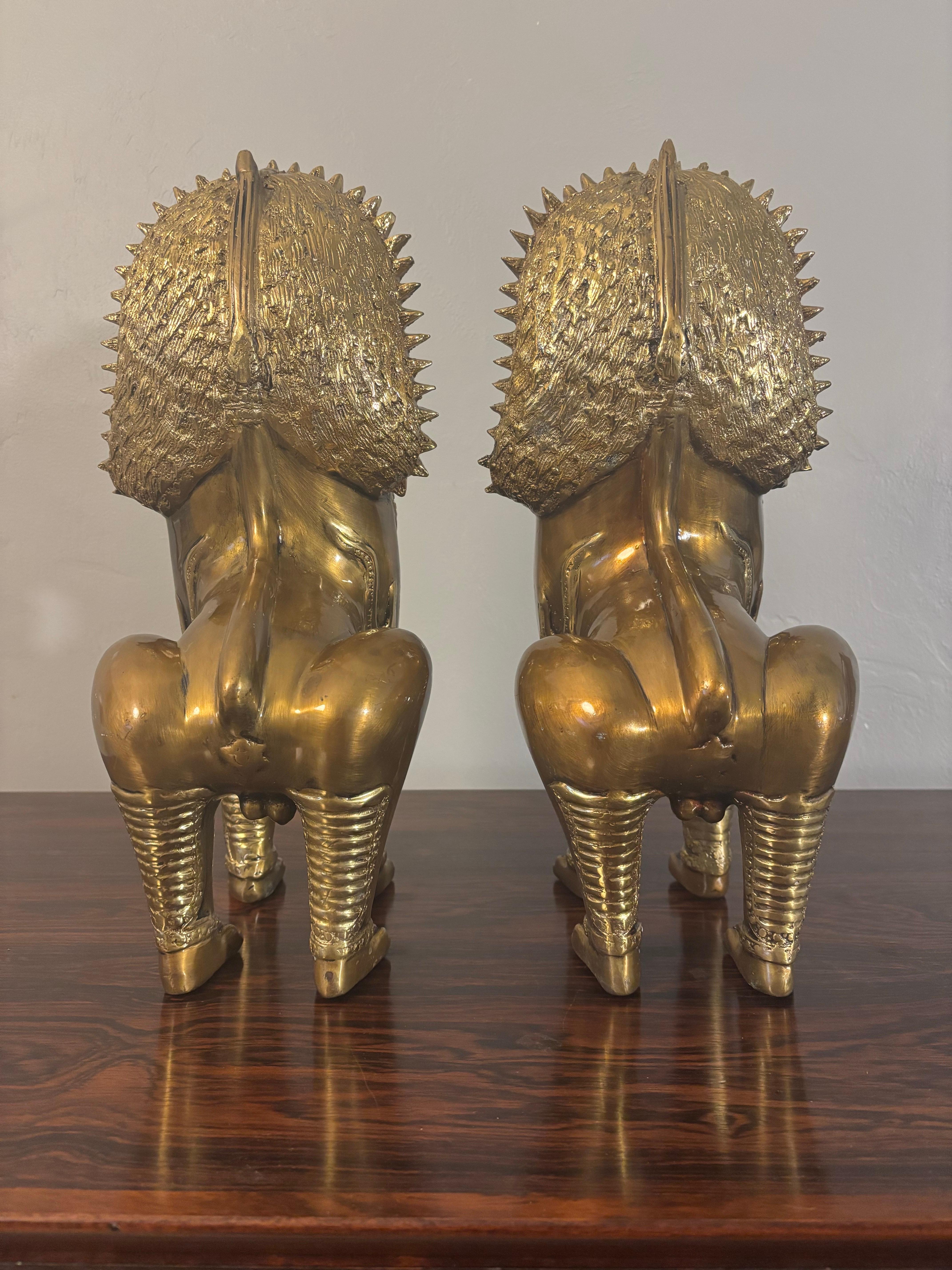 Exceptional pair of brass Khmer guardian lions. Exceptional craftsmanship and attention to fine detail. The use of the guardian lions date back to the 11th century and would flank the main approaches to the Khmer temples. The lion representing