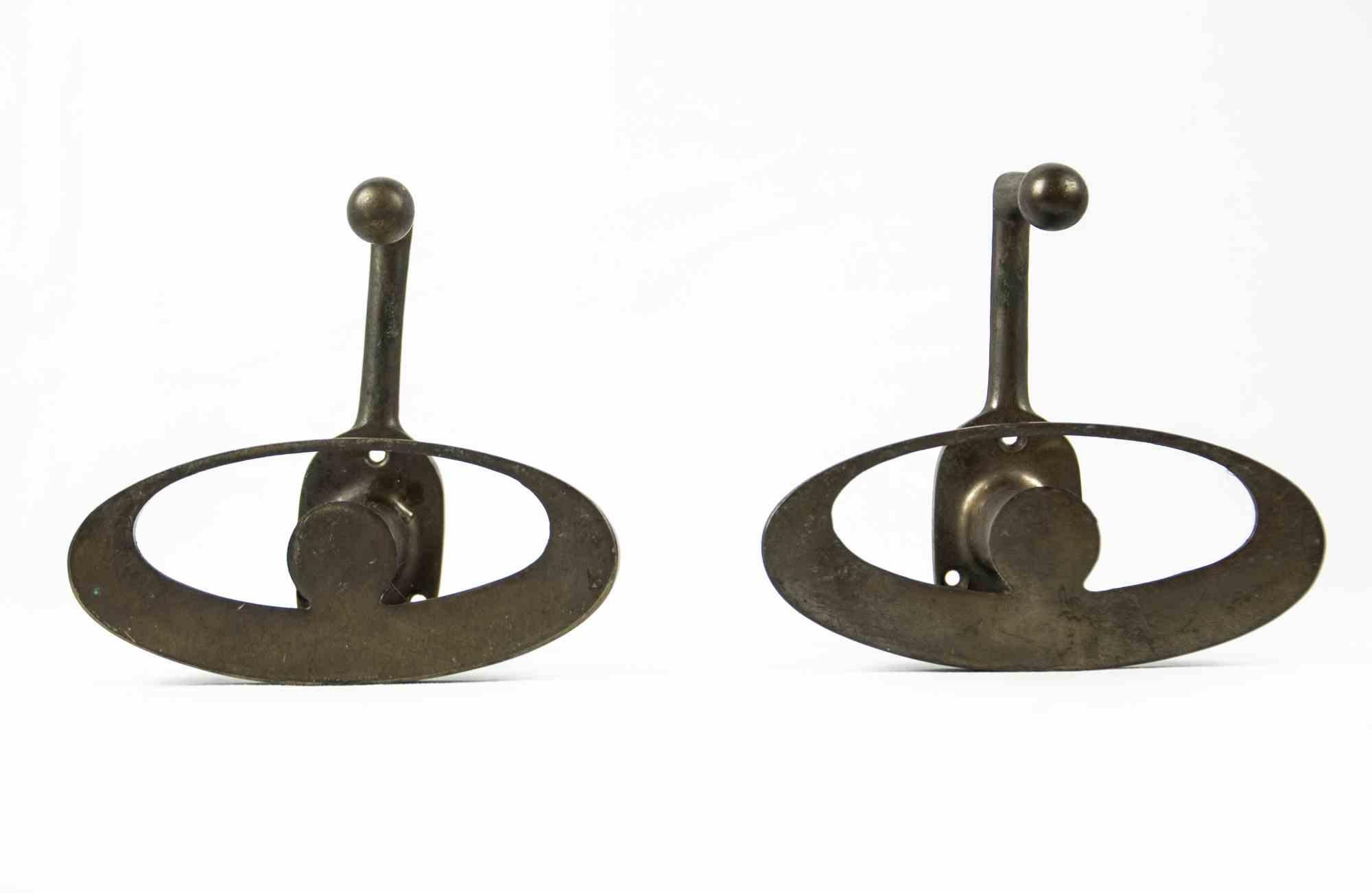 Vintage pair of brass wall hanger is an original decorative pair of objects realized in the half of 20th century.