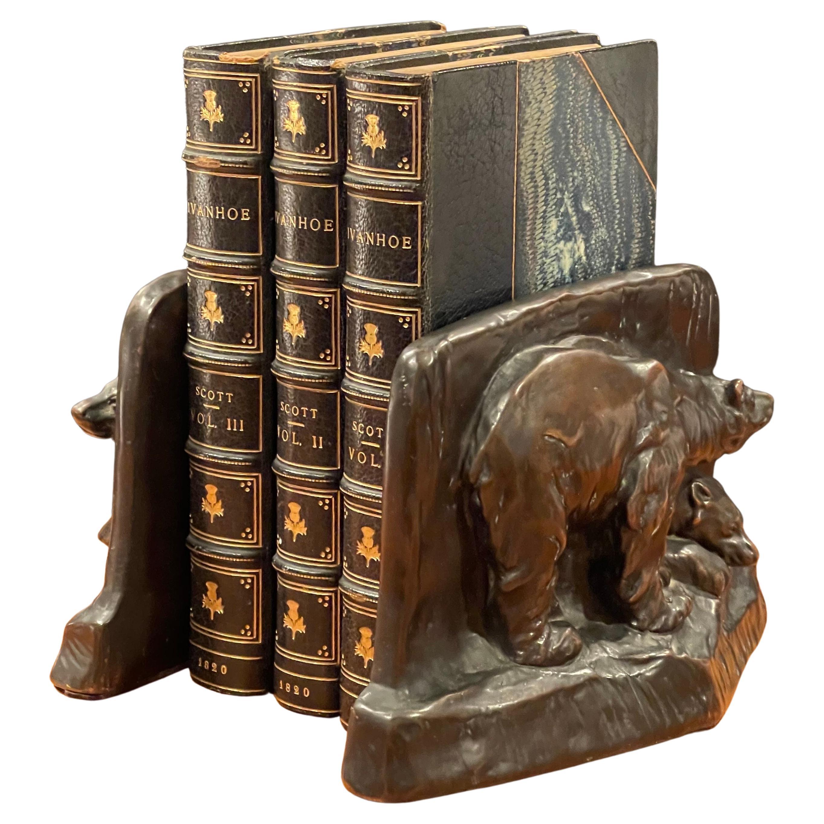 Vintage pair of bronze clad grizzly bear bookends, circa 1940s. They are in original condition with a fine patina, some light oxidation and some surface scratches; the pair measures 5