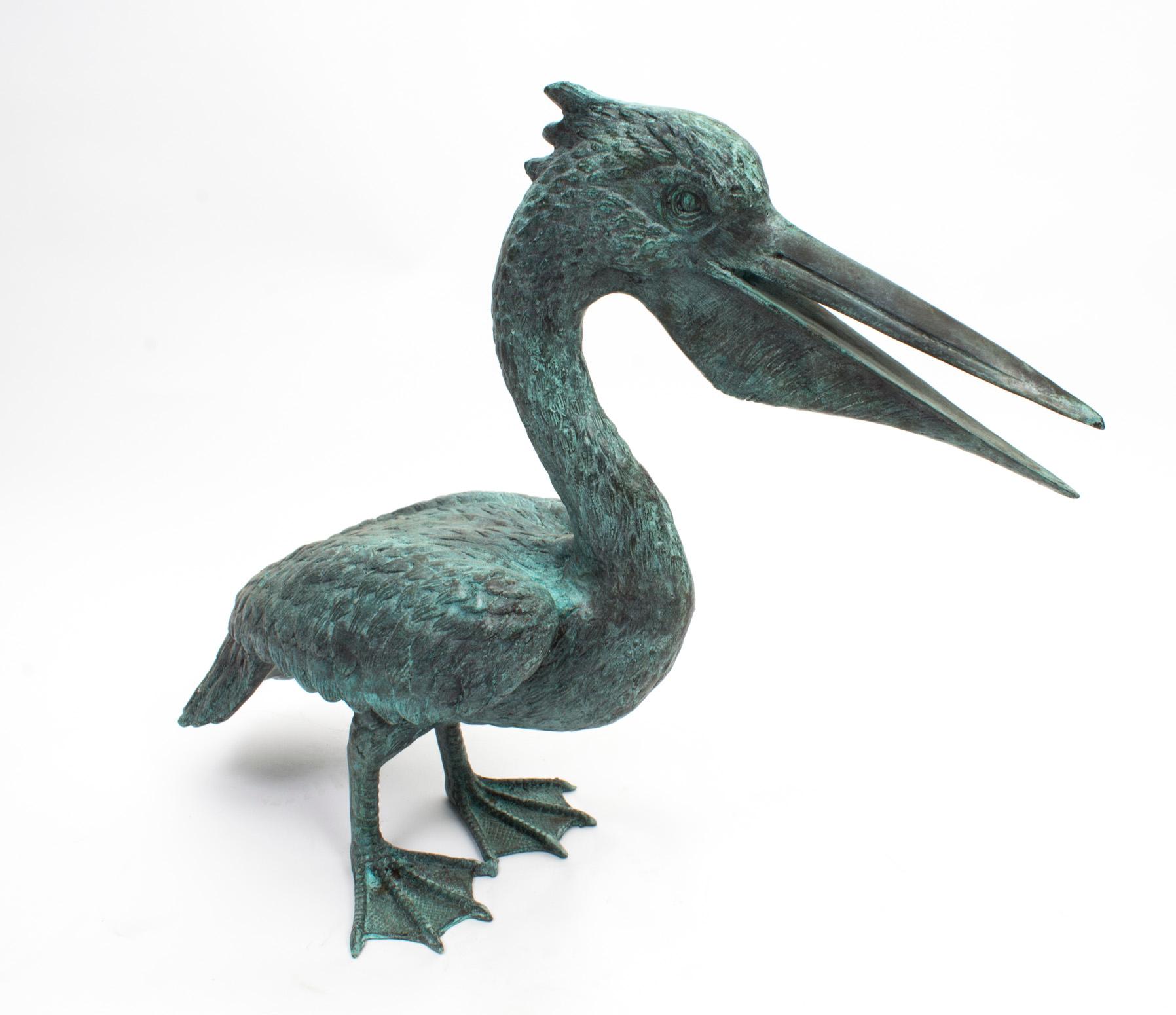This is a lovely Vintage pair of bronze pelicans with fabulous Verdigris patina, dating from the last quarter of the 20th century.

The attention to detail is absolutely fantastic - the elongated beaks, plumage, and webbed feet all appear