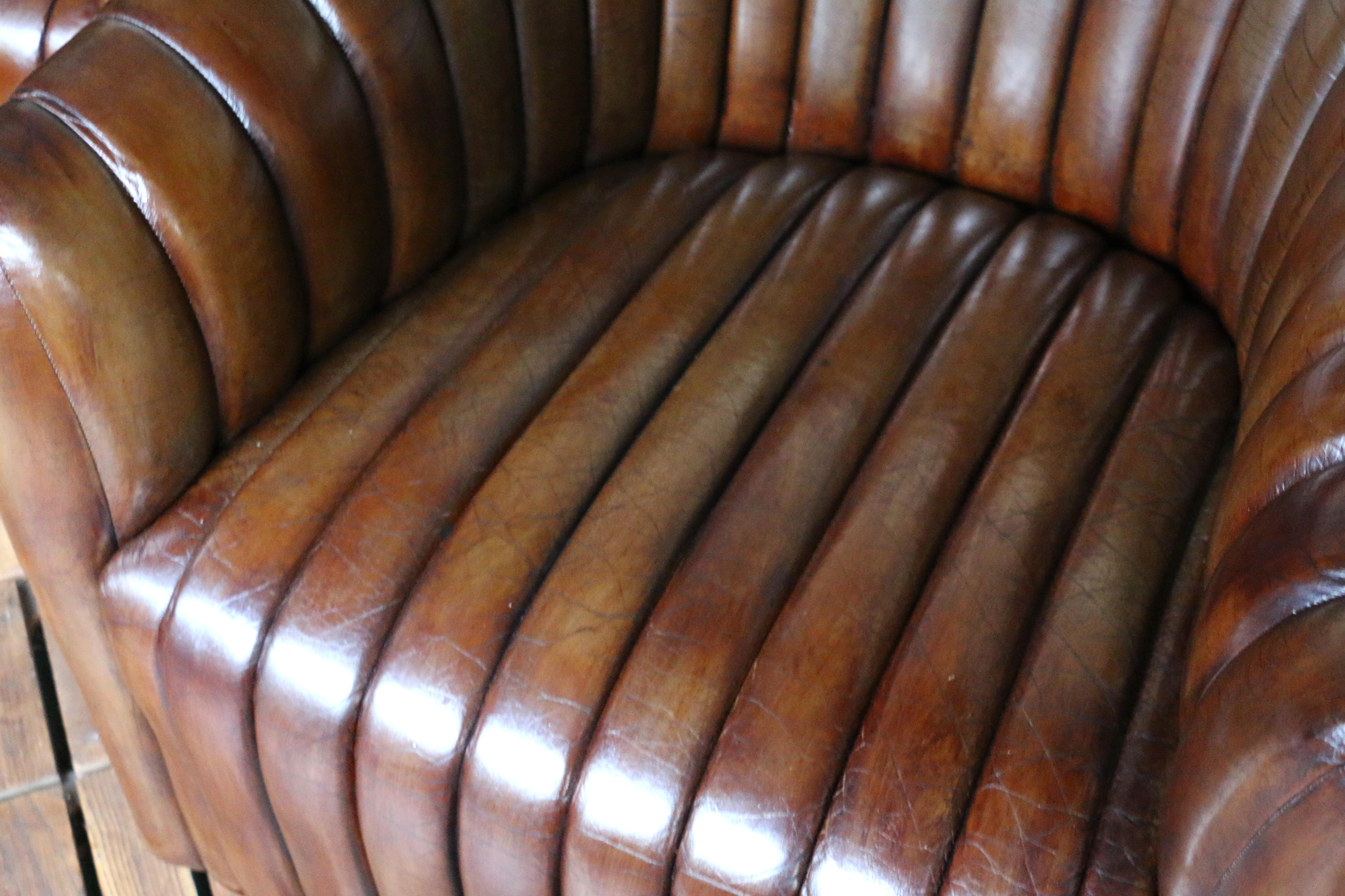 Elevate your space with this vintage 1980s pair of channel-tufted club chairs, manufactured by Martin/Brattrud Inc. in 1987. These chairs feature rich, distressed brown leather that showcases a warm patina and timeless character.

Designed with deep