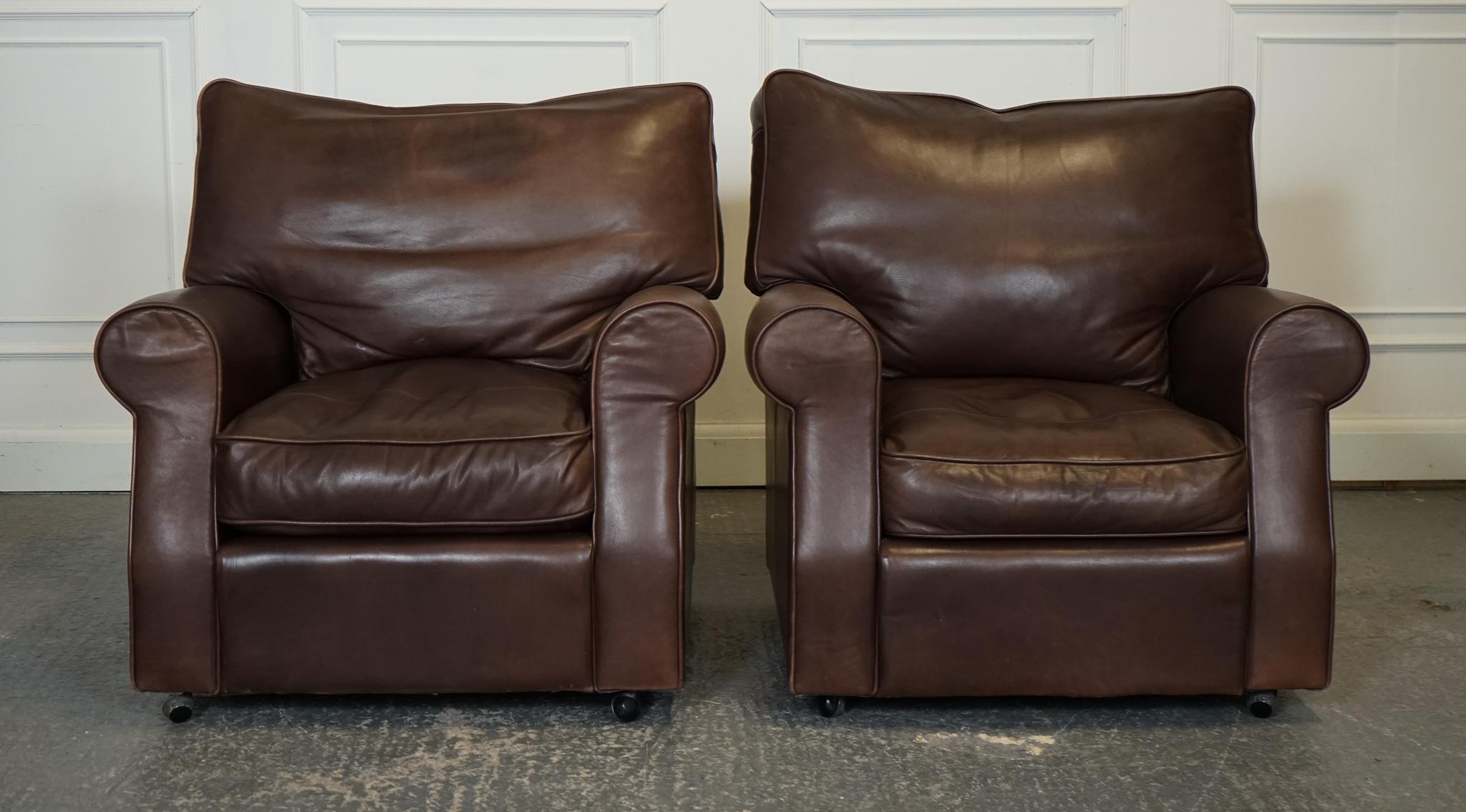 
We are delighted to offer for sale this Vintage Pair Of Brown Leather Collins & Hayes Armchairs.

 The back cushions are feather-filled, still nice and plump. Filled with feathers exudes luxury and comfort. 
These armchairs feature a classic design