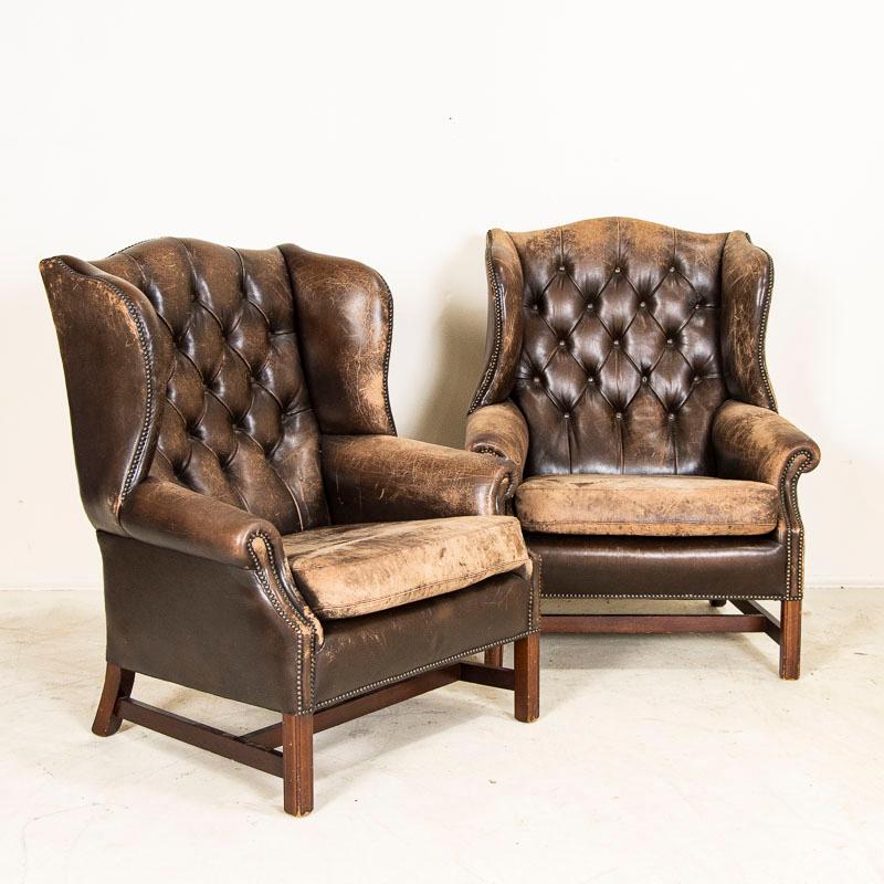 Whether you are ready to read a good book or smoke a cigar, these chairs invites one to sit back, relax and reflect. Vintage club chairs are highly sought after today making this pair a great find. This handsome pair of wingback armchairs is in good