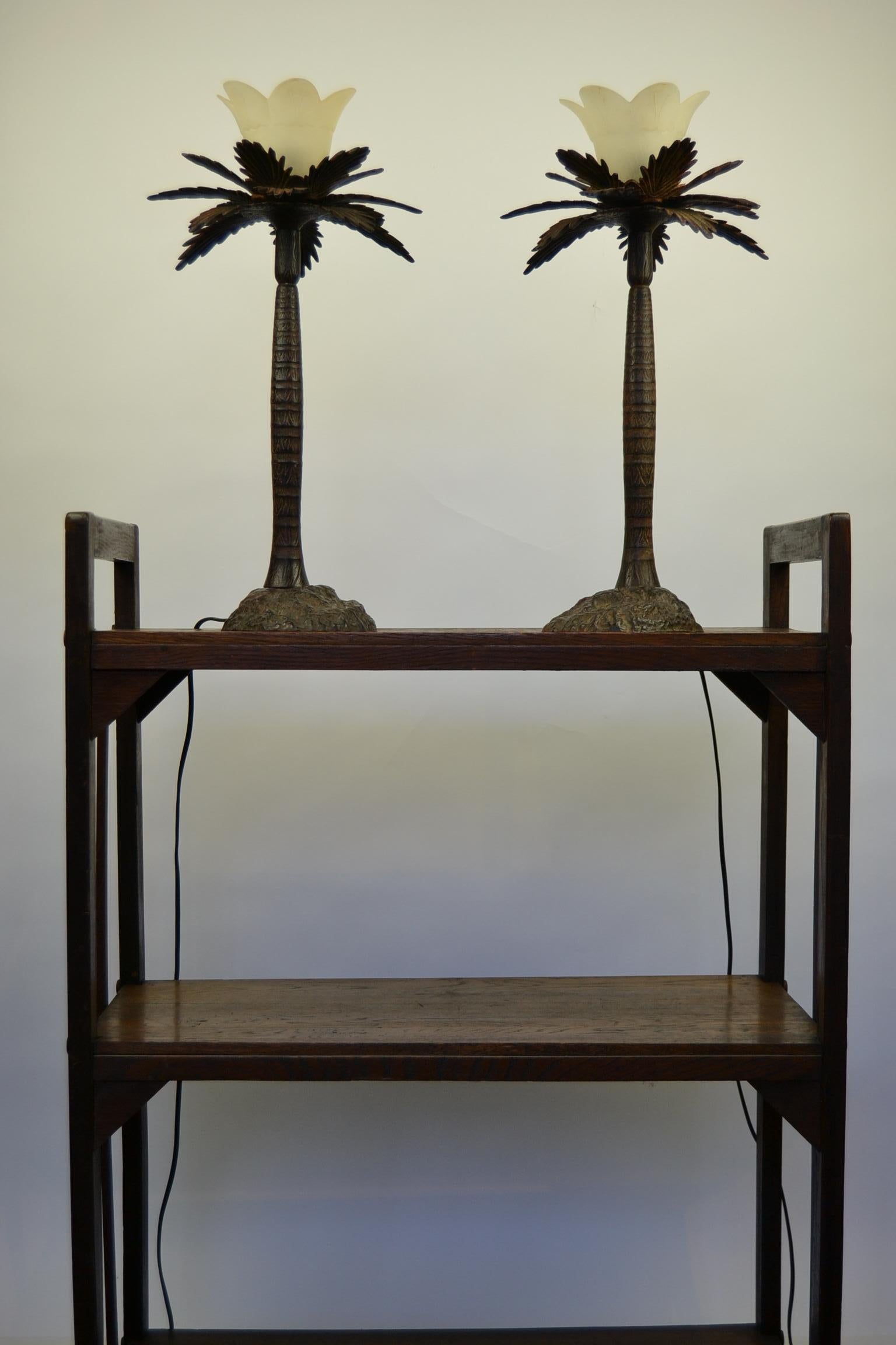 Pair of Brutalist Palm Tree Table Lamps. 
This Palm Tree Table Sculptures date circa 1950s-1960s.
They have Fine detailed Trunk and Leafs. 
Made of Heavy Metal - Cast metal - Painted Metal with Frosted Art Glass Shades. 

Stylish Pair of Palmtree