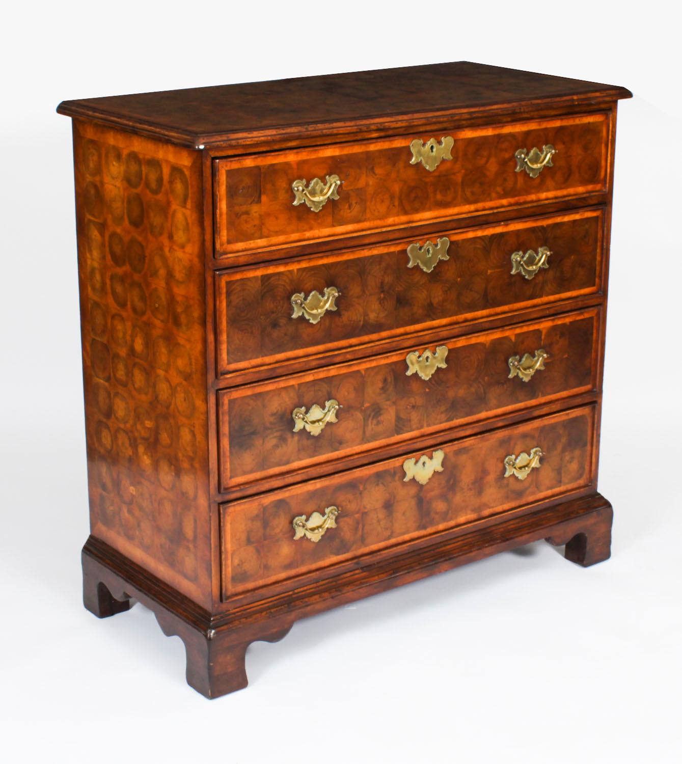 This is a beautiful  Vintage pair of Queen Anne Revival burr walnut oyster veneered chests of drawers, dating from the mid 20th Century.

The chests are masterfully crafted from gorgeous burr walnut oyster veneers. The oyster veneered tops are