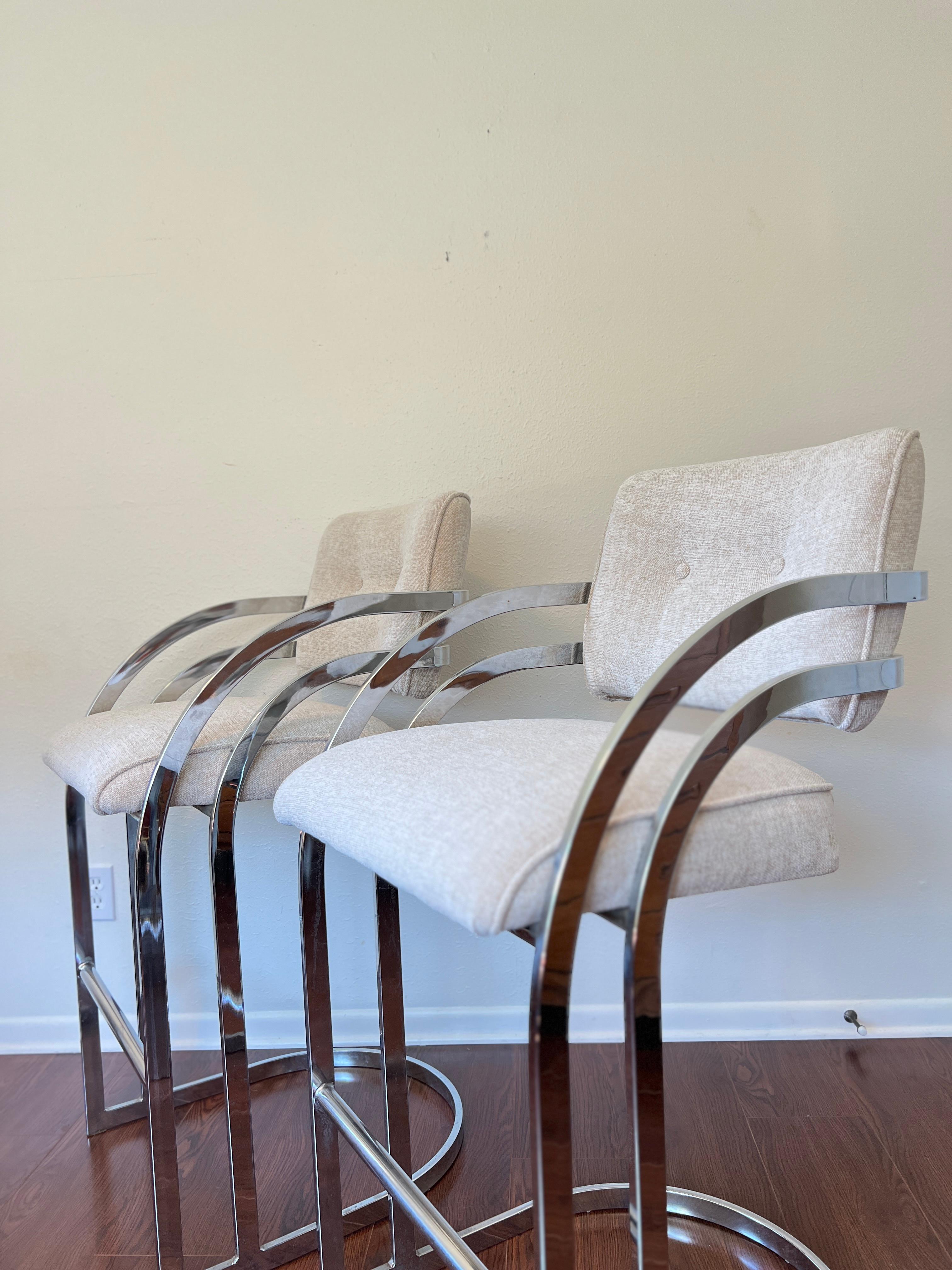 Wonderful pair of cantilever bar stools in the style of Milo Baughman for DIA. Features sturdy metal frames with foot rest and subtle rounded armrests. Newly recovered and in great condition. ?
Dimensions:
42.5” H x 20.5” W x 29.5” D
Seat Height: