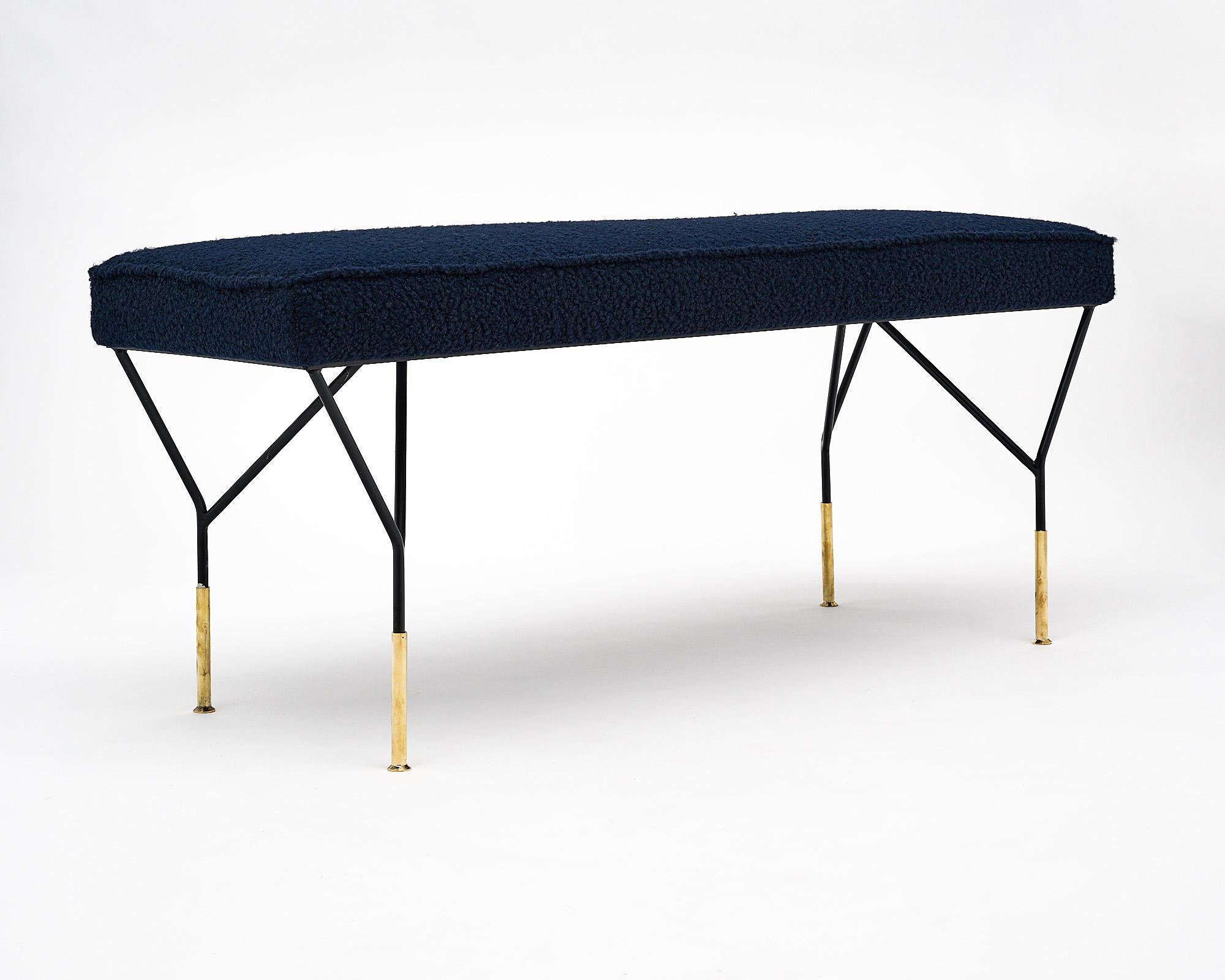 Pair of Italian benches with black lacquered steel and brass legs. New upholstery done in a navy blue wool blend.