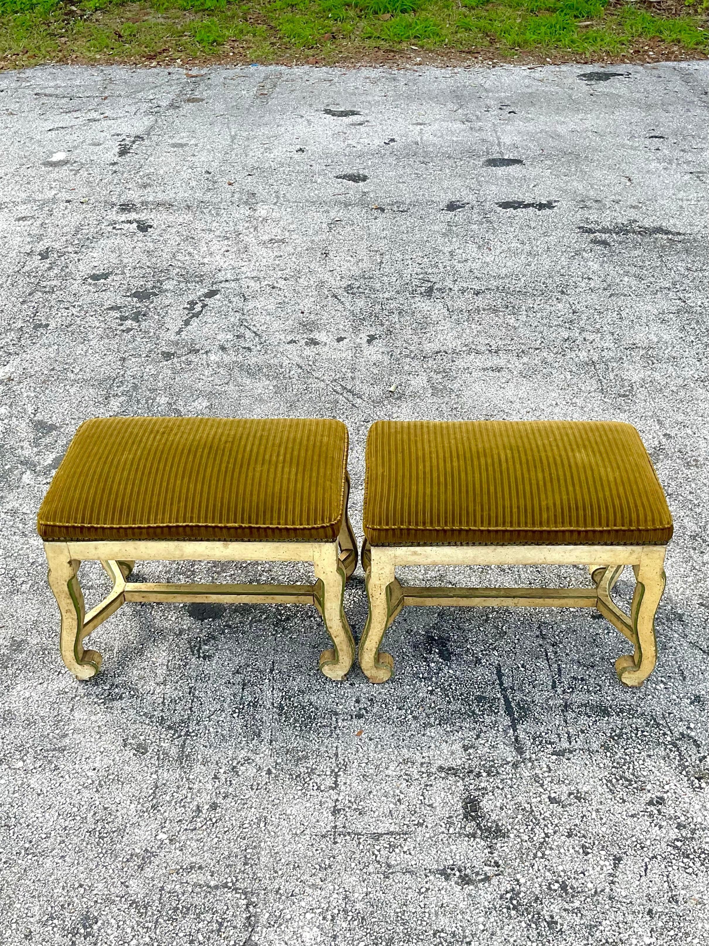 Fantastic vintage pair of corduroy upholstered painted wooden carved ottomans or stools with a fabulous nailhead trim around the base and matched piping at the top. Perfect addition to any salon needing a touch of old world elegance and modern day