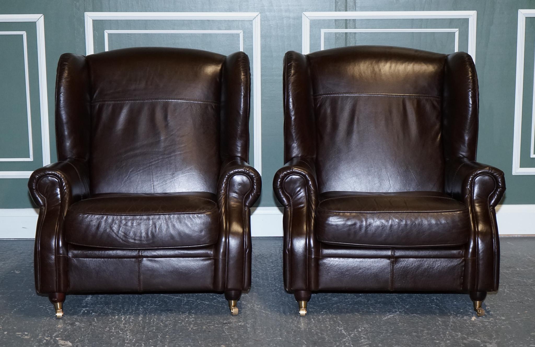 We are excited to present a pair of chocolate brown leather wingback chairs.

Very good-looking pair, in very clean order.
The leather has come back really nice and looks like new.

We have a matching two to three-seater available, please have a
