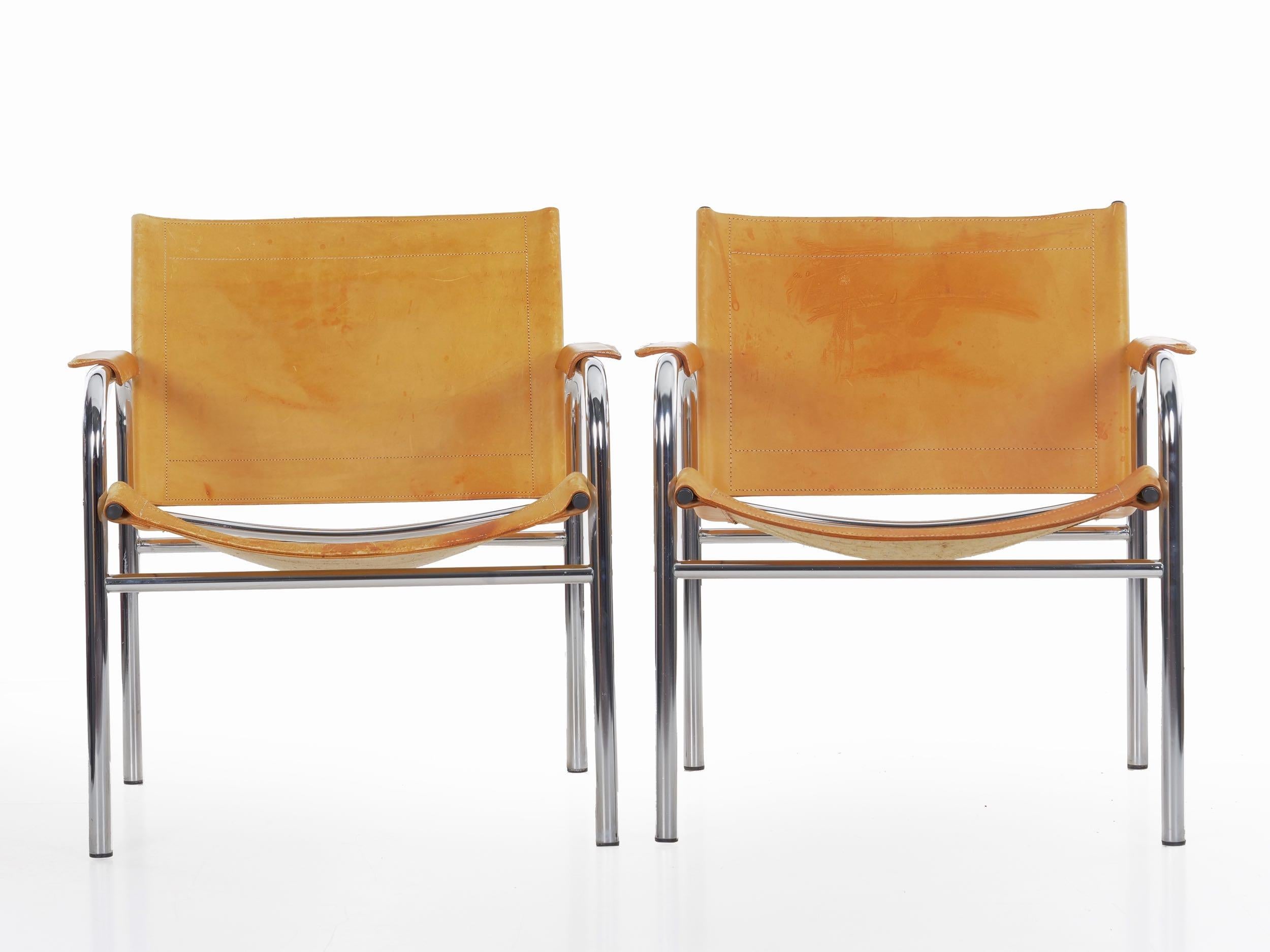 A very cool iconic design by Tord Bjorklund, these simple chromed steel tubular frames are made so interesting with the heavy stitched vegetable dyed cognac brown leather that has worn wonderfully over the years.

Measurements: 29 5/8