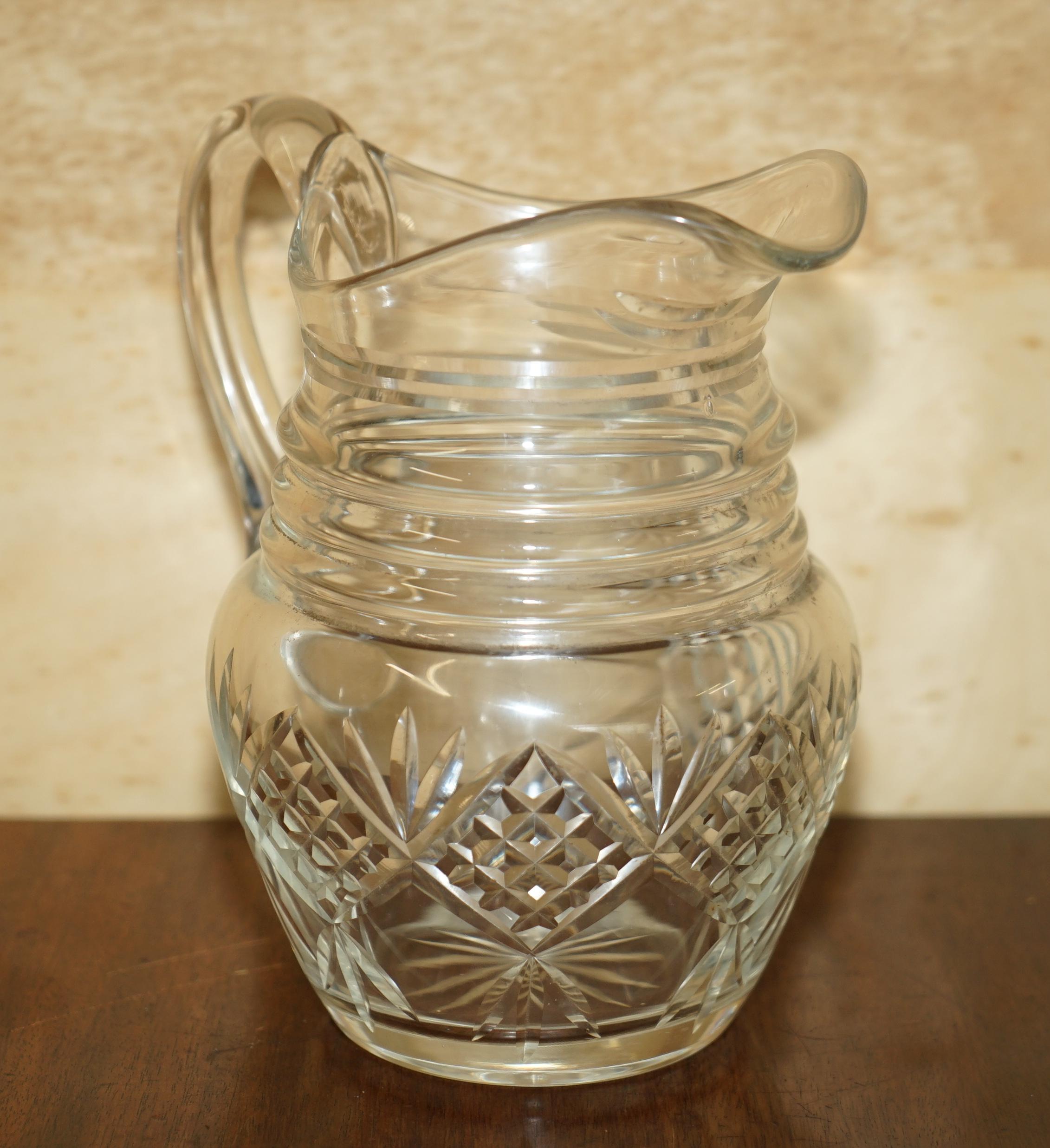 We are delighted to offer for sale this lovely pair of antique circa 1930’s Art Deco cut glass jugs for cocktail bars

A very decorative and well made pairing, they are very heavy for the size

The condition is perfect for the age so far as I