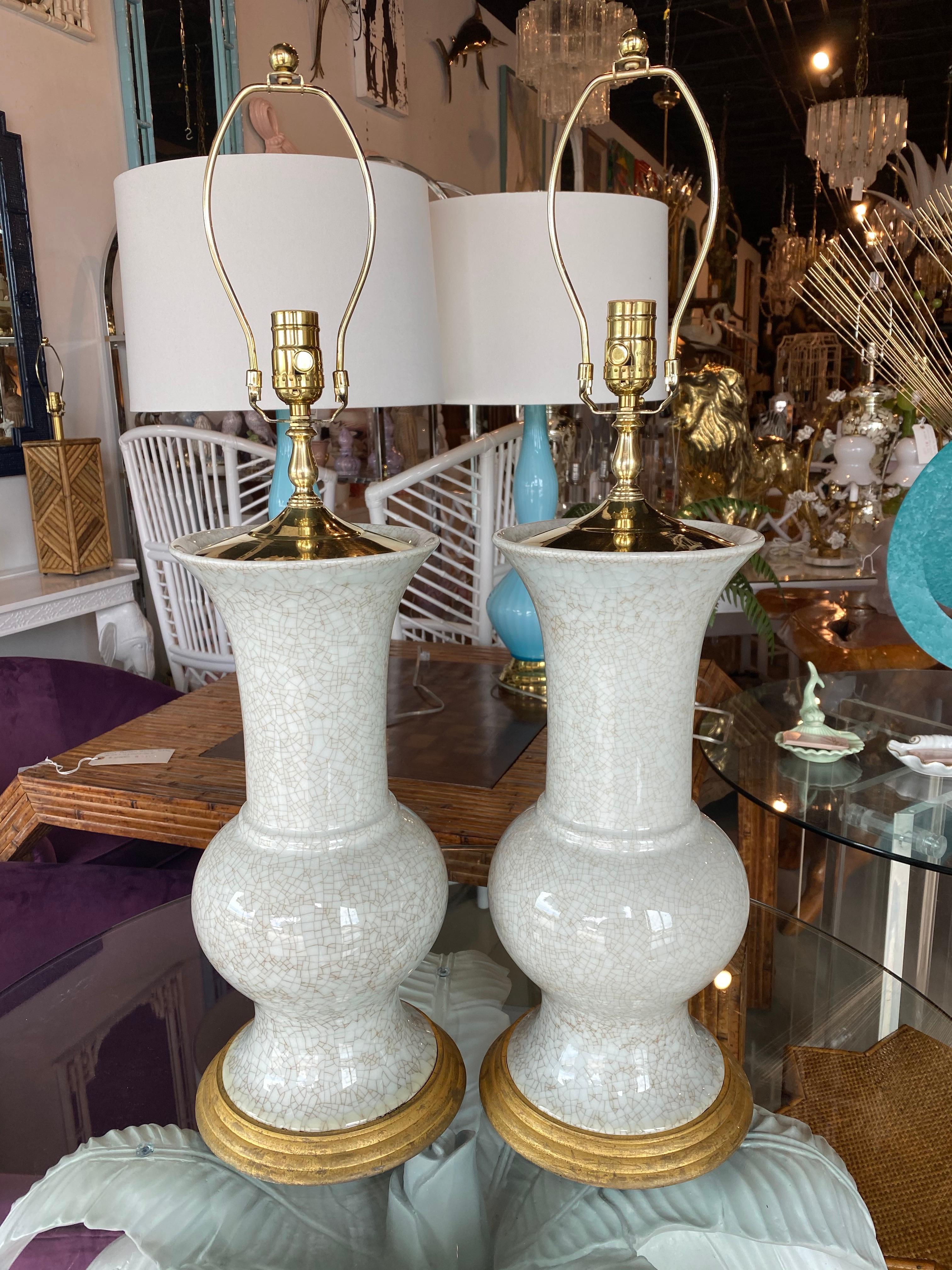 Lovely vintage pair of crackle glaze ceramic table lamps. These came out of the Breakers Palm Beach many years ago. They have been newly wired. All new brass hardware.
Measures: Height to socket 23.5
Height to finial 30.
