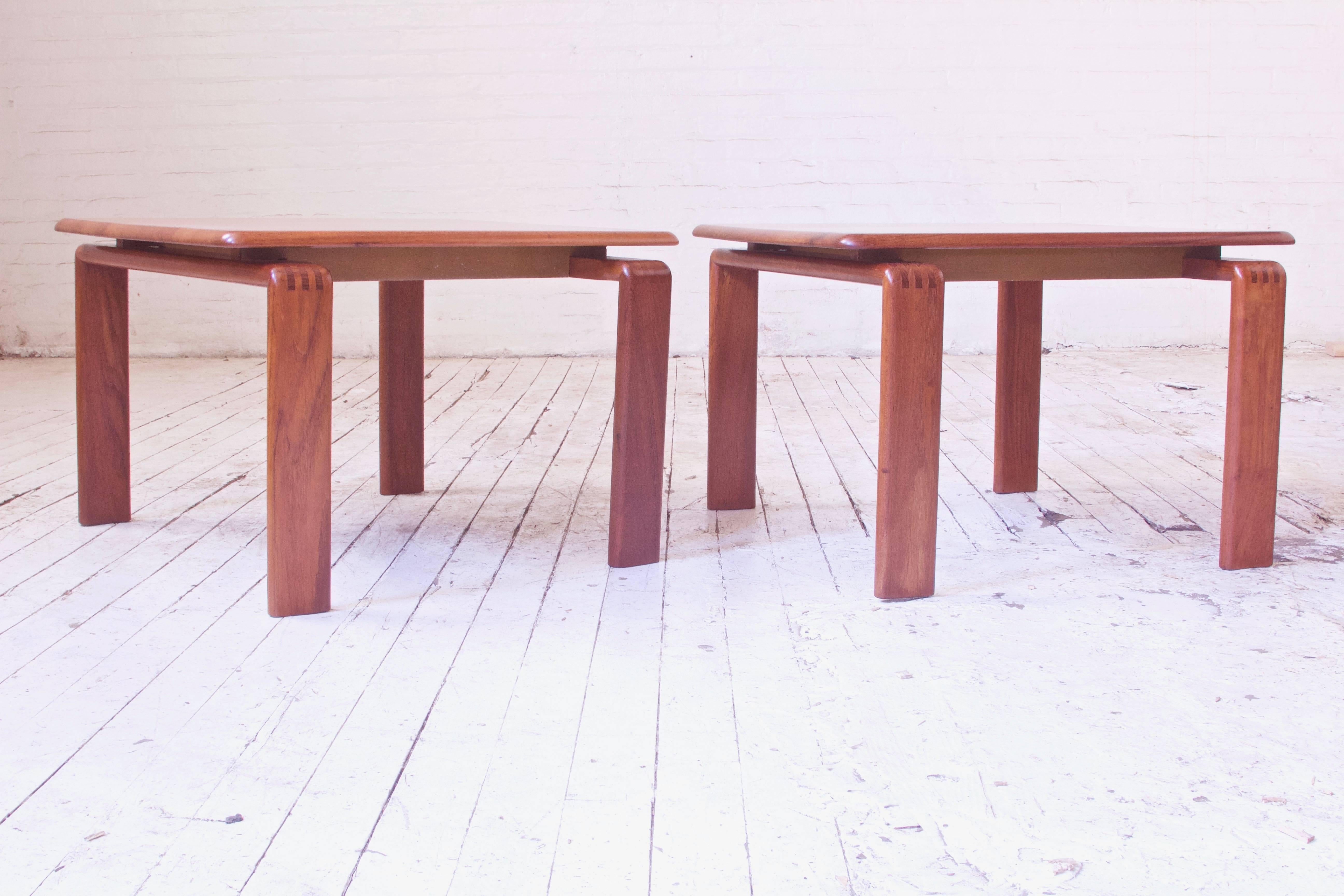 Great vintage pair of well-made and substantial teak side tables with floating tops and exposed finger joinery. Lovely timber selection with both quarter and flat sawn boards adding variety and dynamism to the laminated tops demountable construction