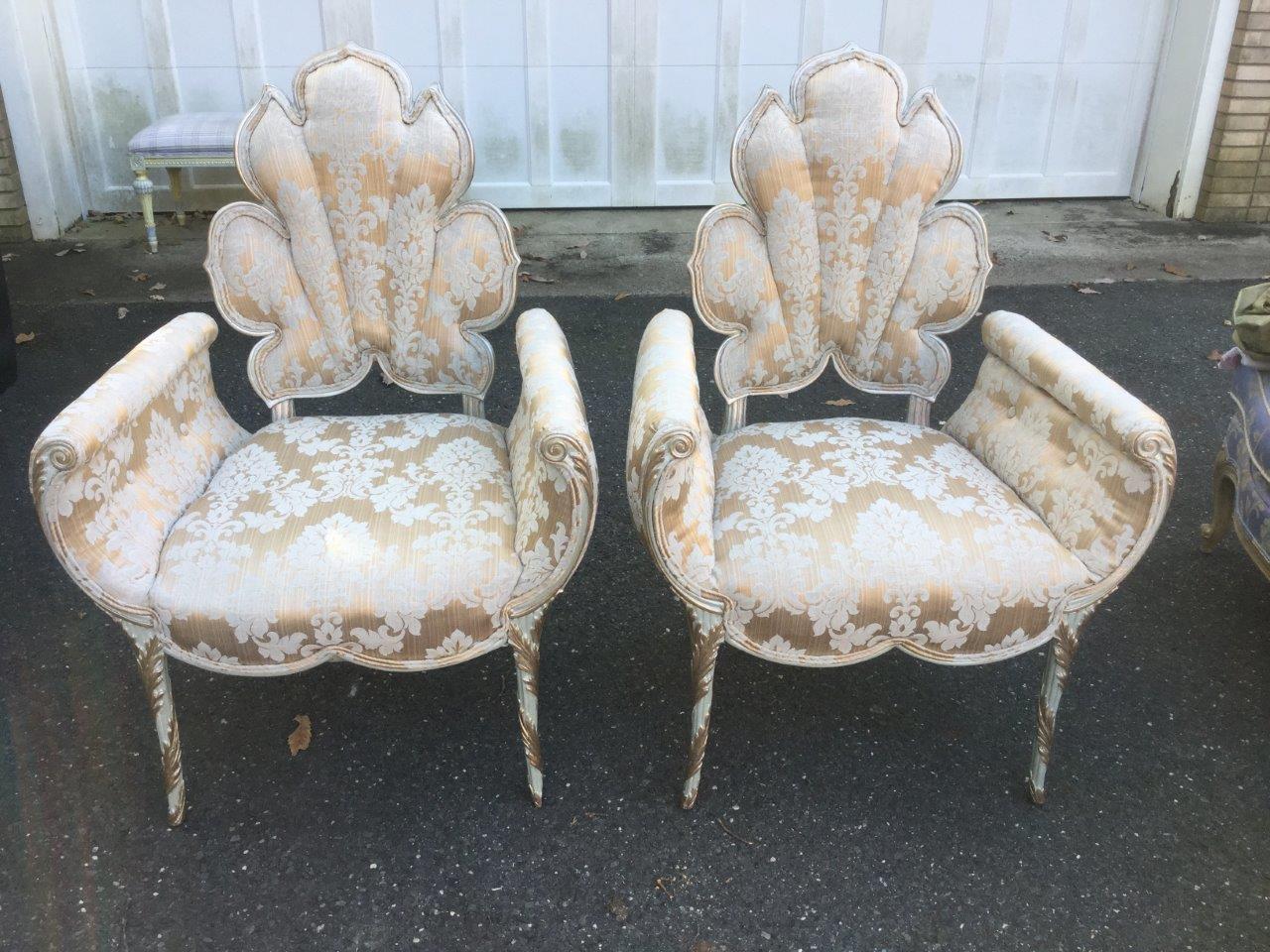 Fabulously theatrical pair of Oscar de la Renta tulip chairs having wide rolled arms and a tulip shaped back painted in a very pale shade of green with a champagne color overlay. The upholstery is a vintage silk damask and the back is a coordinating
