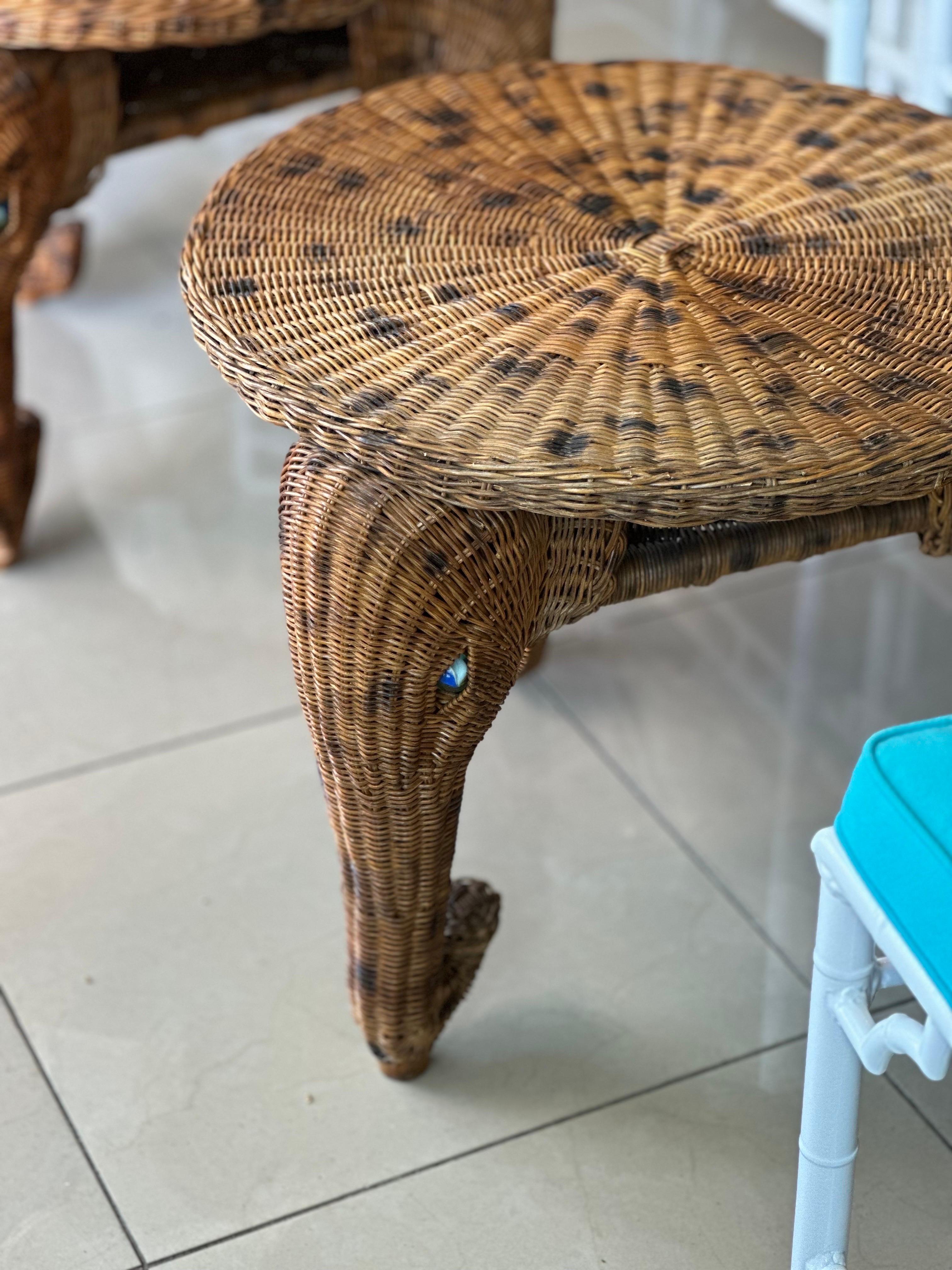 The most amazing vintage pair of wicker elephant side end tables. I have never seen anything like these before! Fabulous large glass marble eyes. Original finish. Dimensions: 20 H x 28 W x 28 D. The top is 24 D.