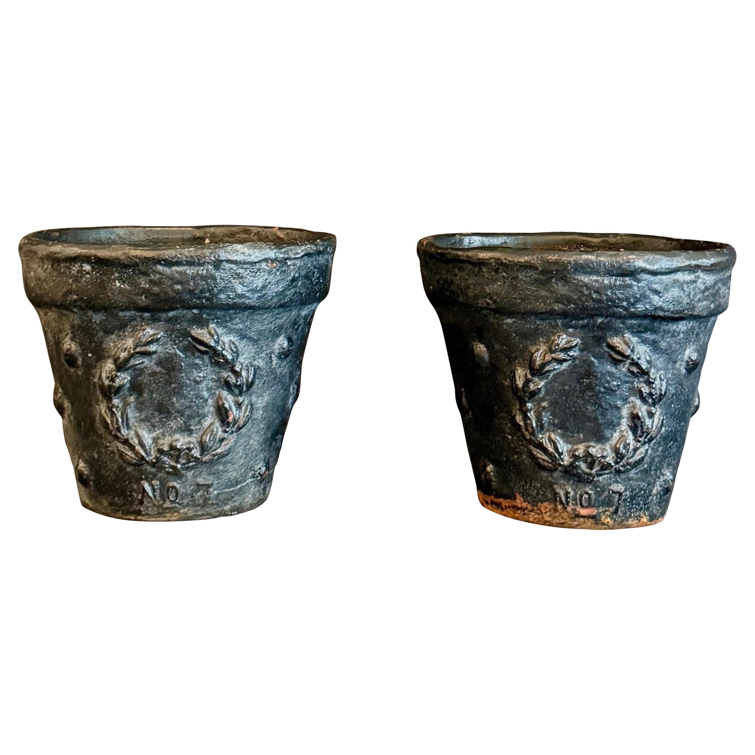 Vintage Pair of English Black Cast Iron Planters with Laurel Wreath Pattern For Sale