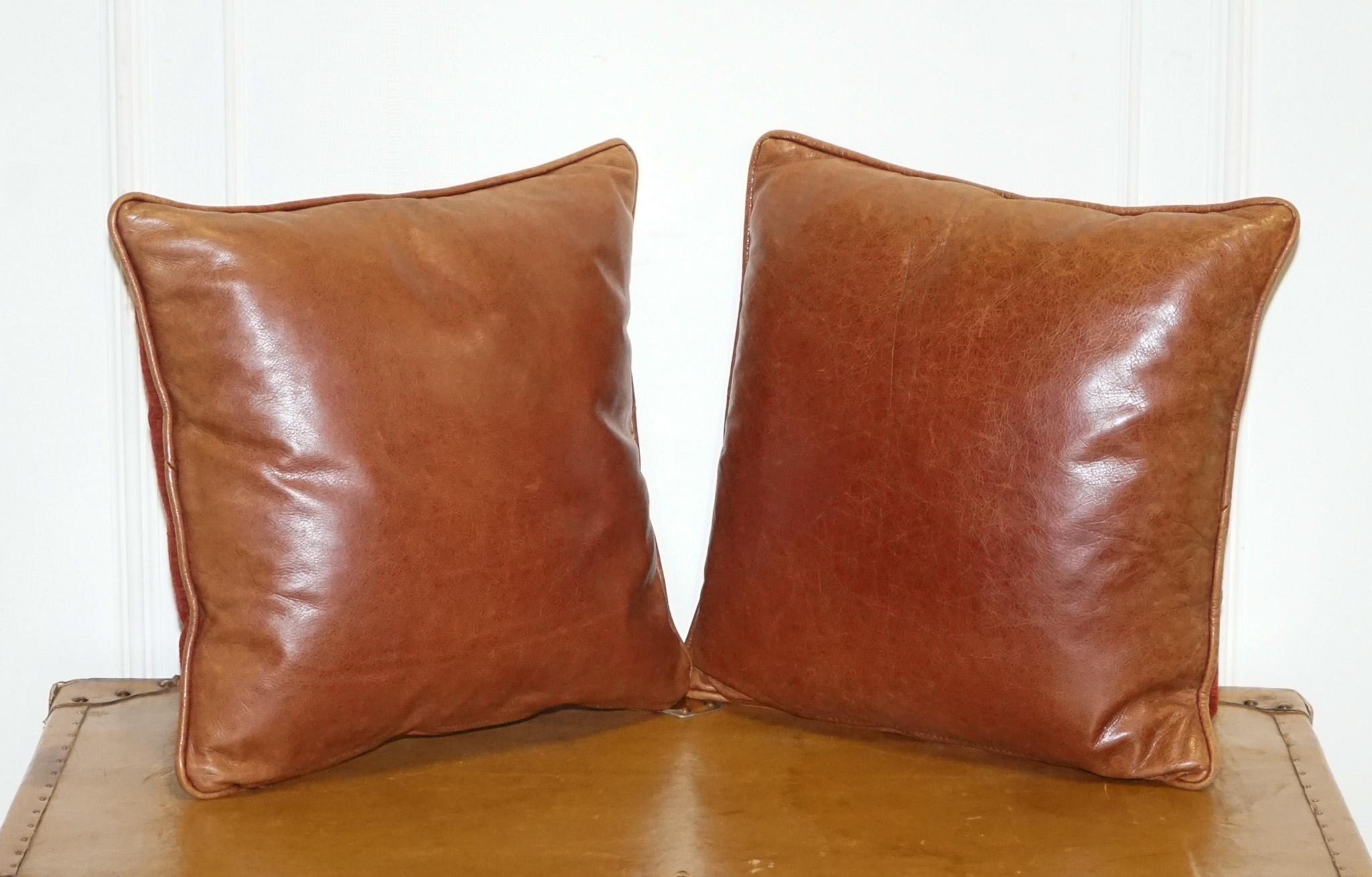 
Antiques of London



Elevate your interiors with this stylish pair of high-quality feather-filled cushions. One side features a rich chestnut brown leather, offering a warm, rustic appeal with a buttery-soft texture and natural character. 

The