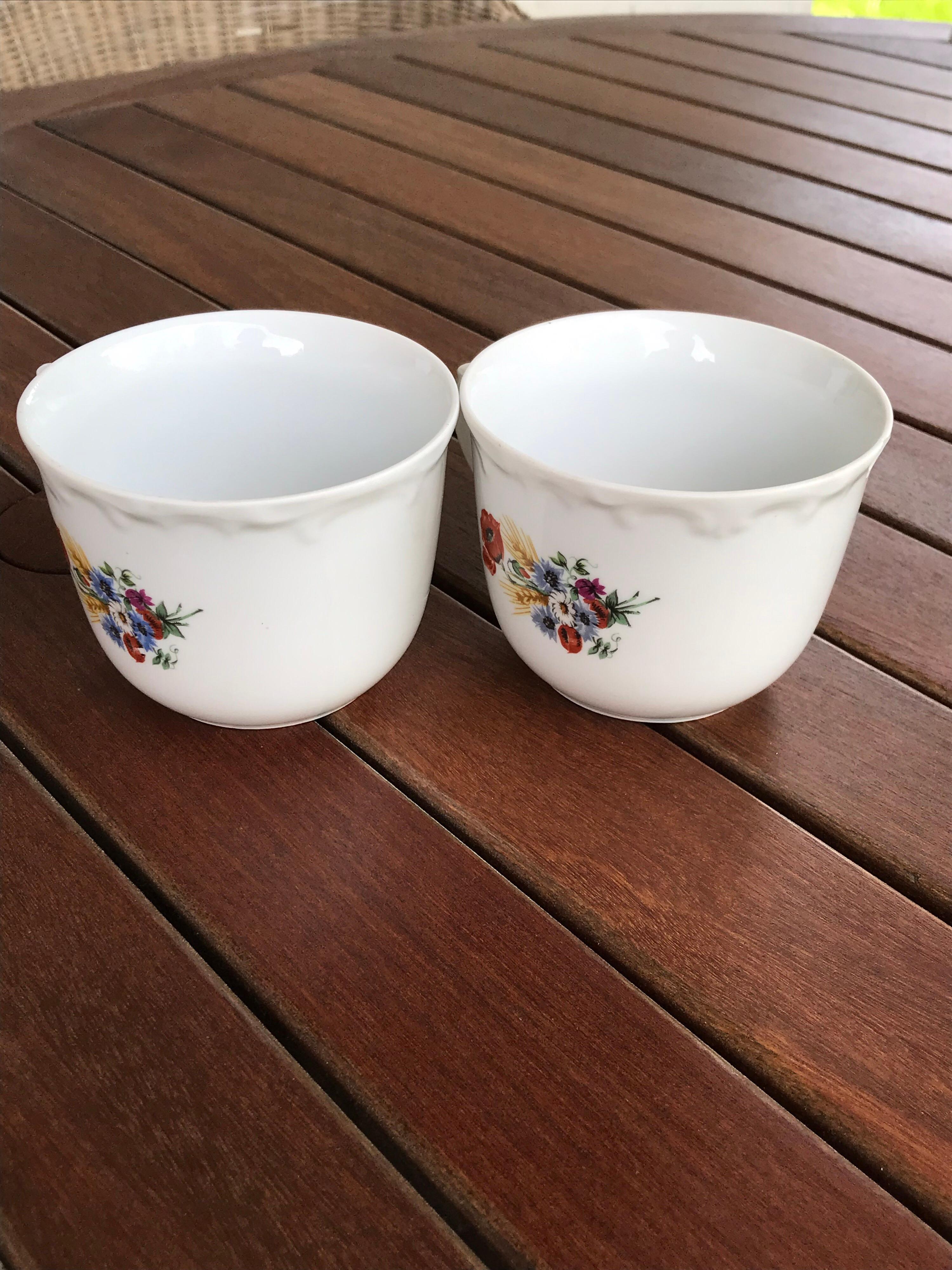 Vintage pair of fine porcelain Kahla tea cups with multi-color floral design - made in GDR
this is a beautiful pair of Kahla floral designed tea cups. The tea cups are very delicate and extremely fine.